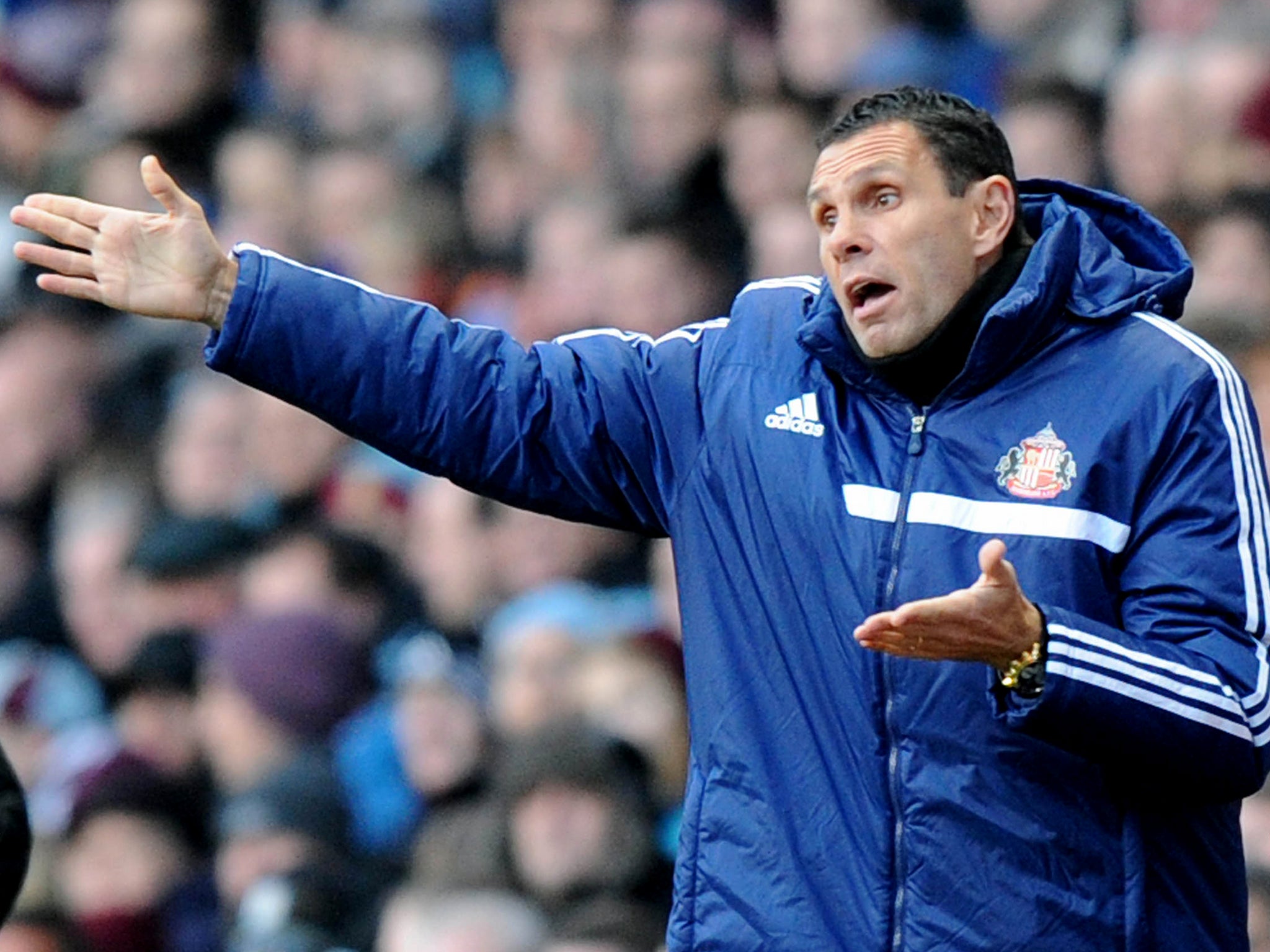 Manager Gus Poyet urges his Sunderland team on at Villa Park.