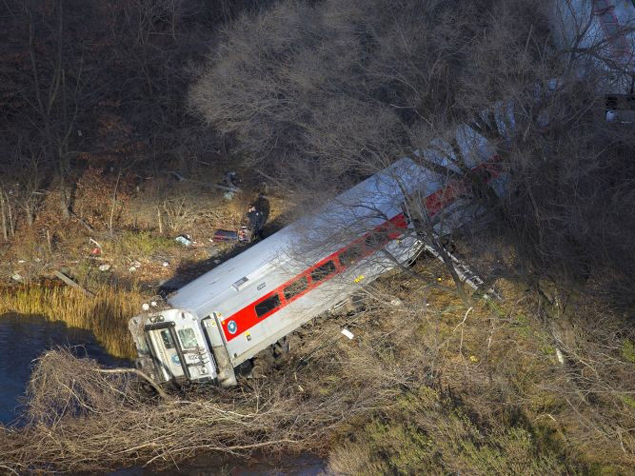 The end of the train juts out over the river