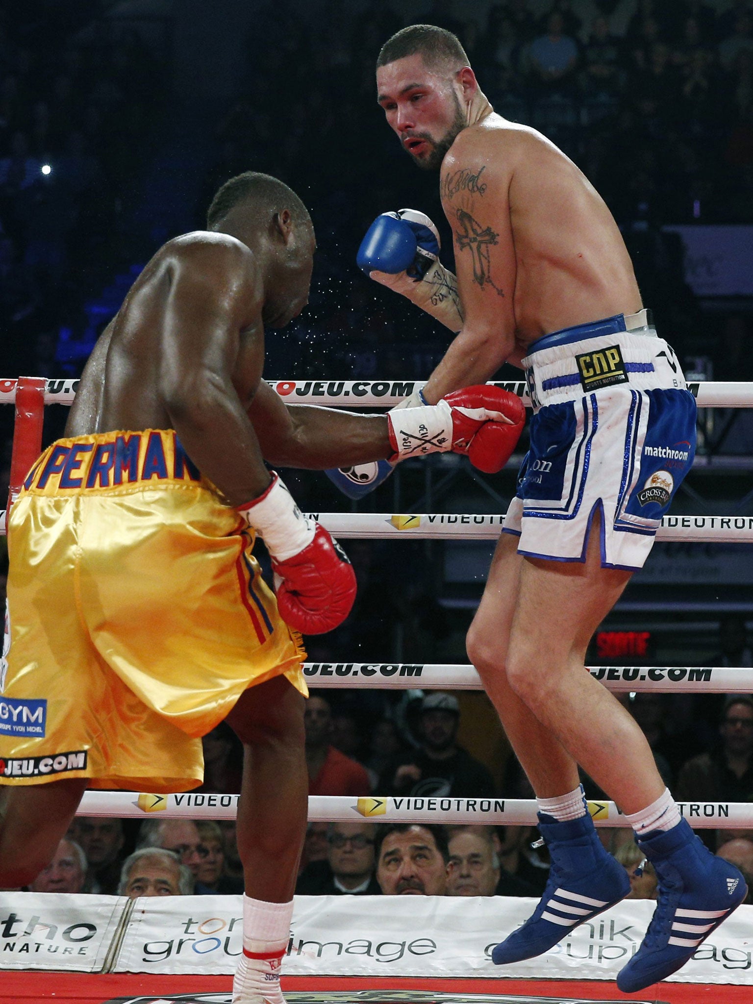 Tony Bellew, right, on his way to defeat against Adonis Stevenson in Quebec City