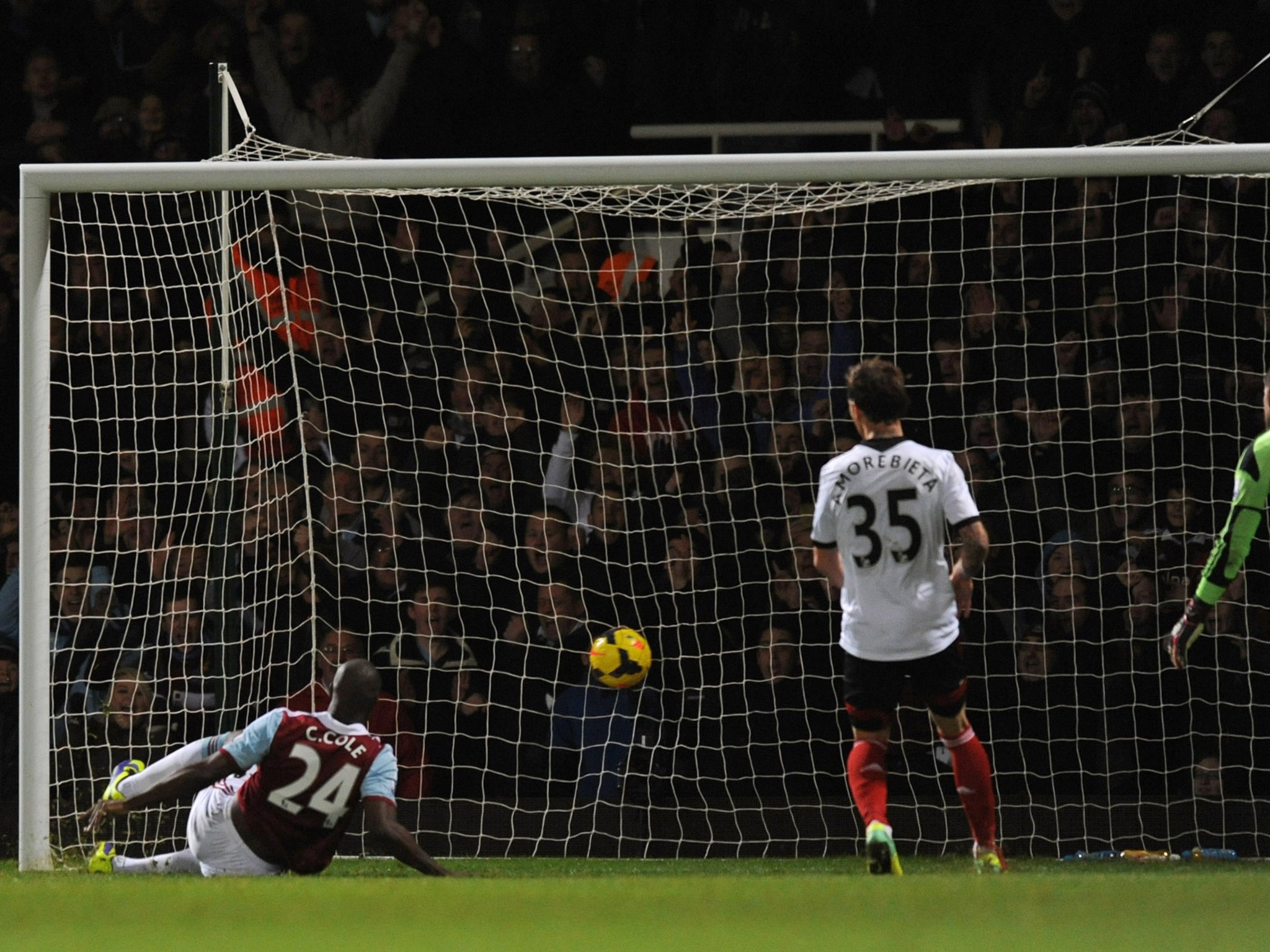 West Ham striker Carlton Cole scores against Fulham in the Premier League