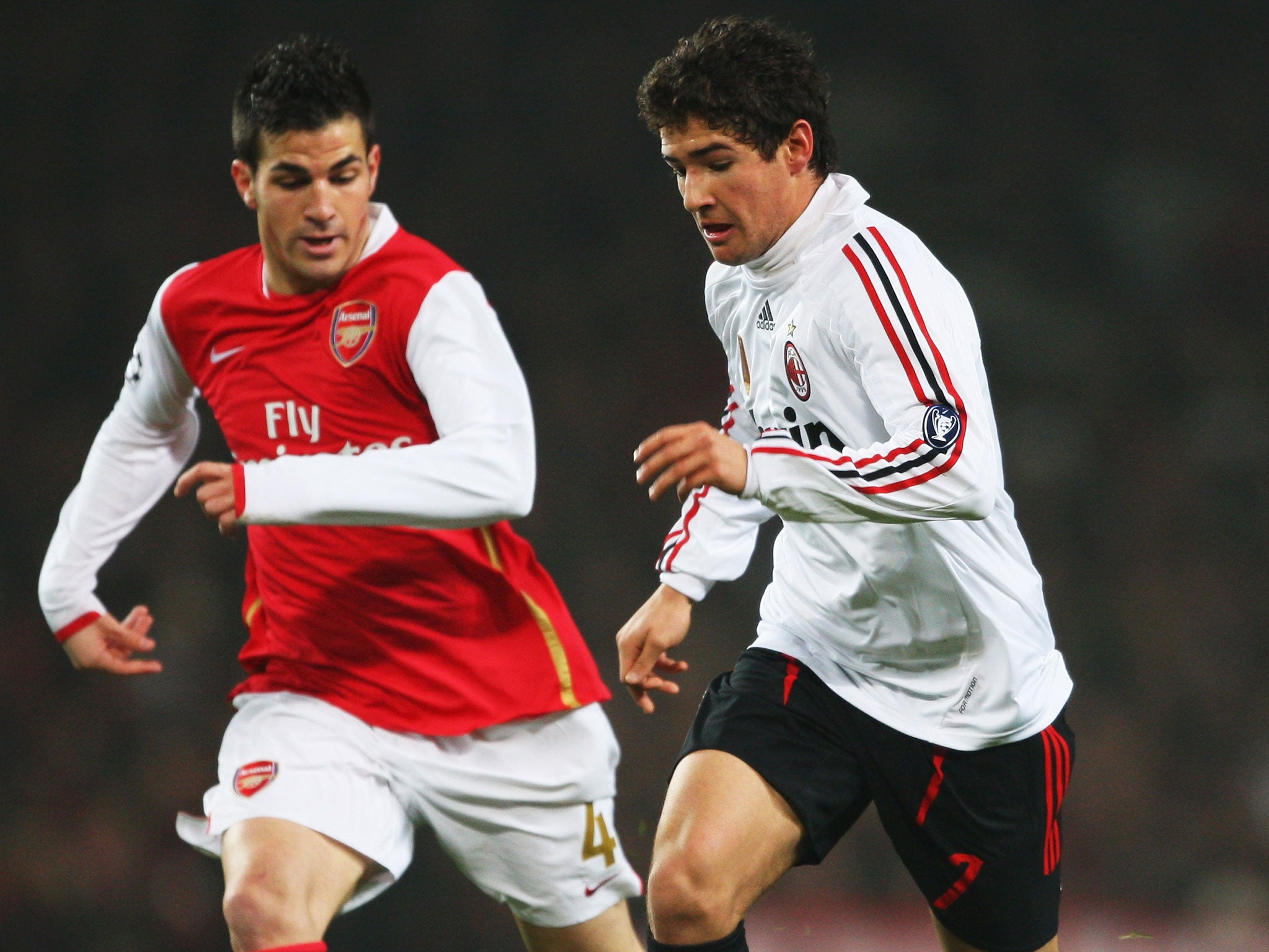 Milan's Alexandre Pato (right) takes the ball past Arsenal's Cesc Fabregas at the Emirates Stadium in the Champions League in February 2008