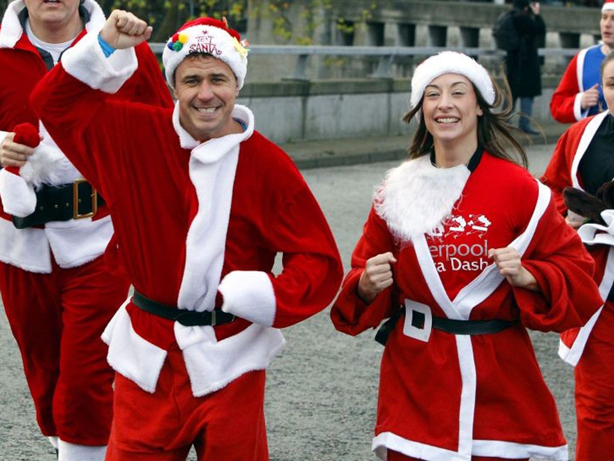 Craig Phillips (left) with other runners dressed as Santa taking part in the Liverpool Santa Dash, with an expected 10,000 people participating in the 5k run for charity