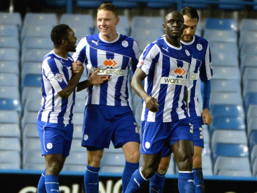 Sheffield Wednesday’s Connor Wickham (second left) scored both goals in the defeat of Leicester