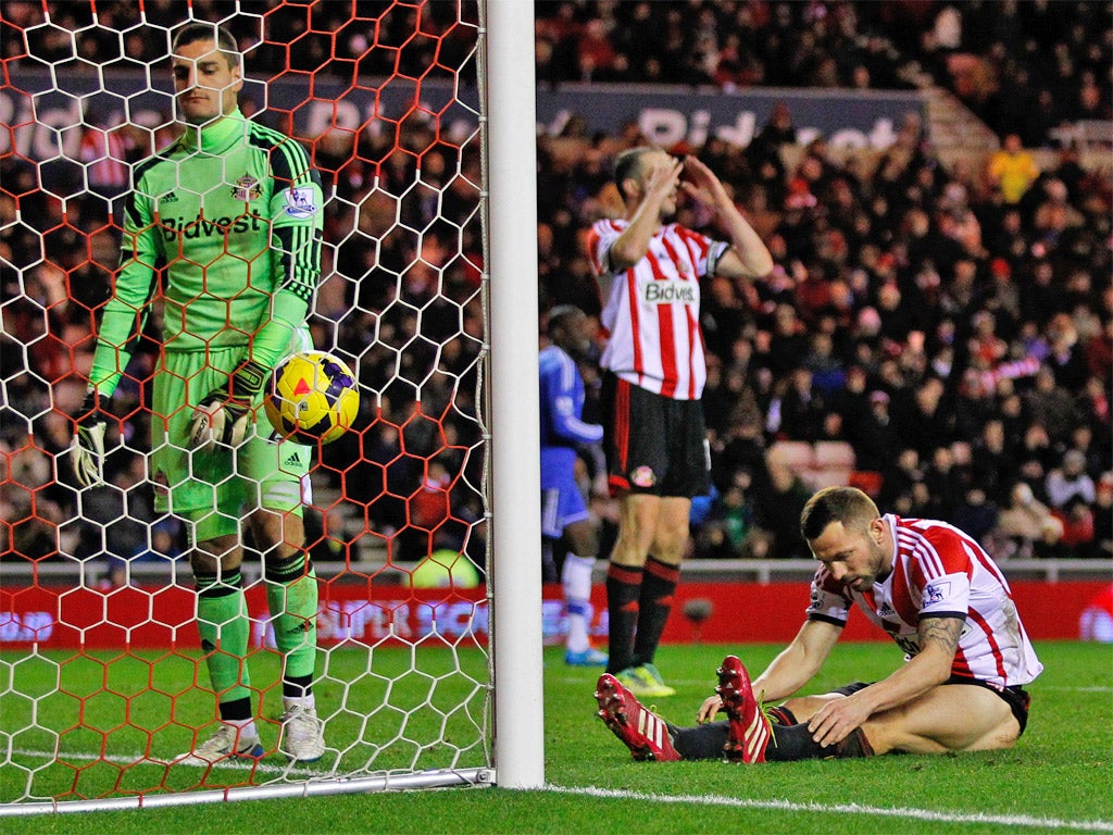 Phil Bardsley looks down after scoring past his own goalkeeper