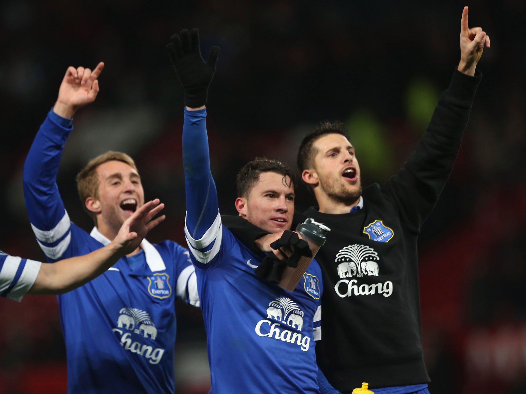 Everton players celebrate their win over Manchester United after Bryan Oviedo's (C) late winner