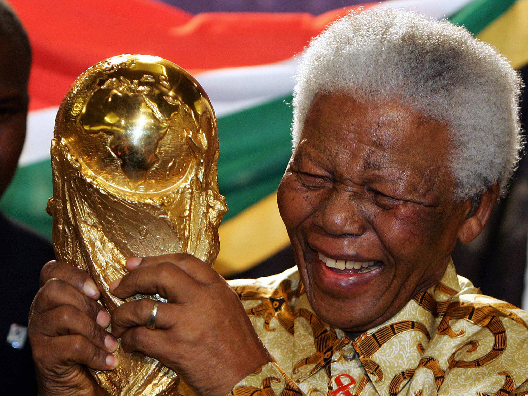 Nelson Mandela with the World Cup in 2010