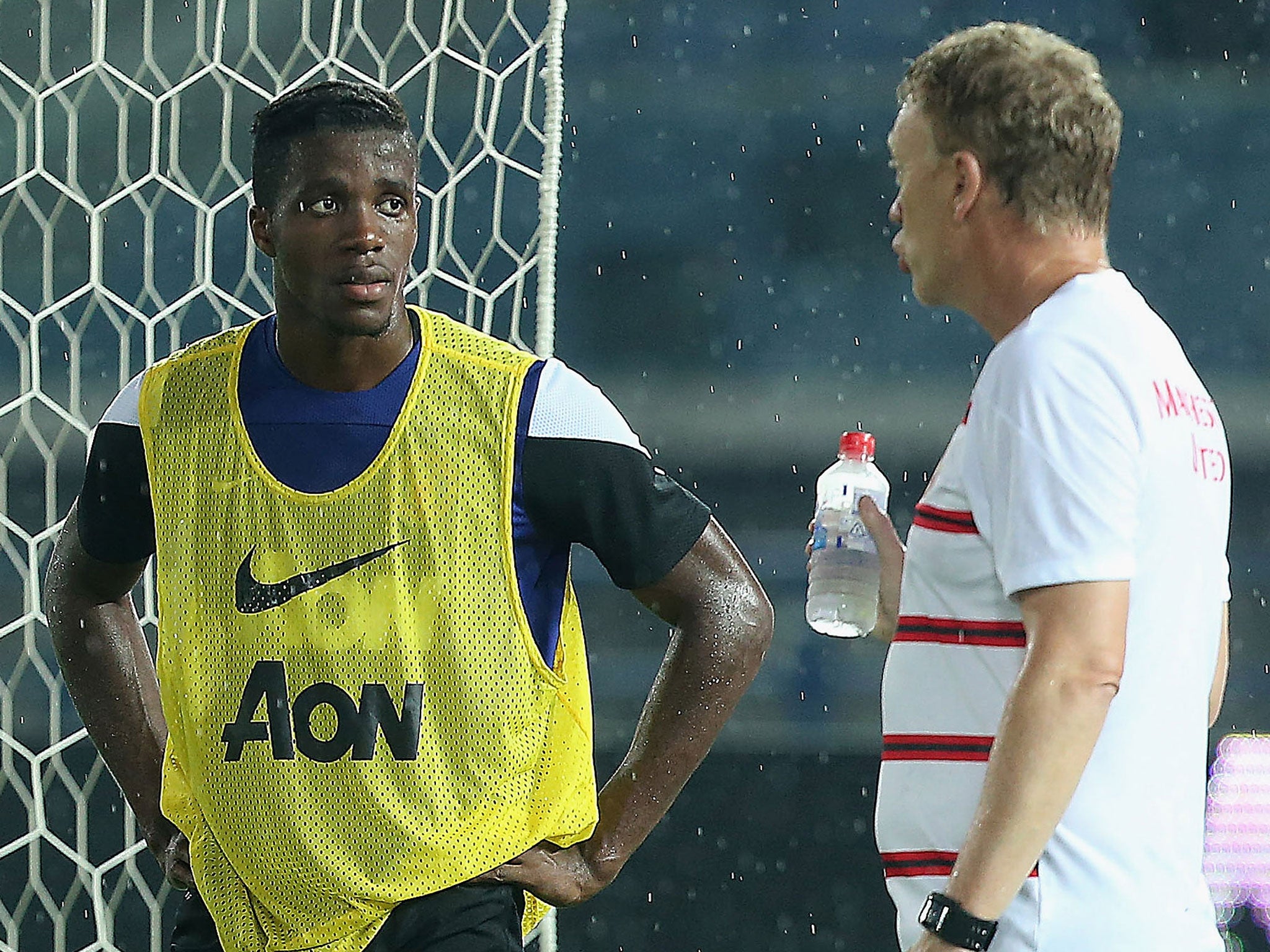 Wilfried Zaha (left) speaks to David Moyes during Manchester United pre-season training