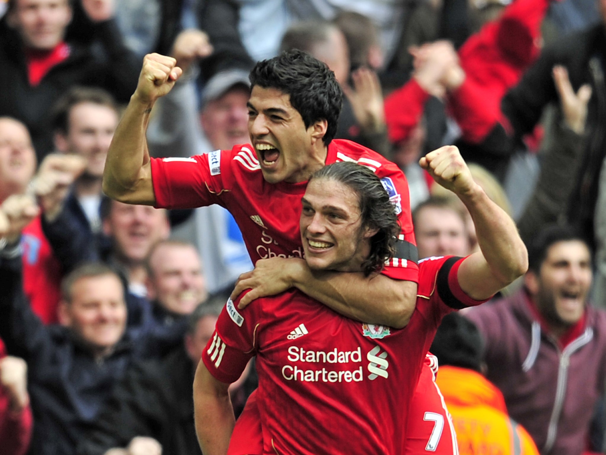 LIttle and large: Andy Carroll and Luis SUarez were both wigned for Liverpool in January 2011 after the sale of Fernando Torres