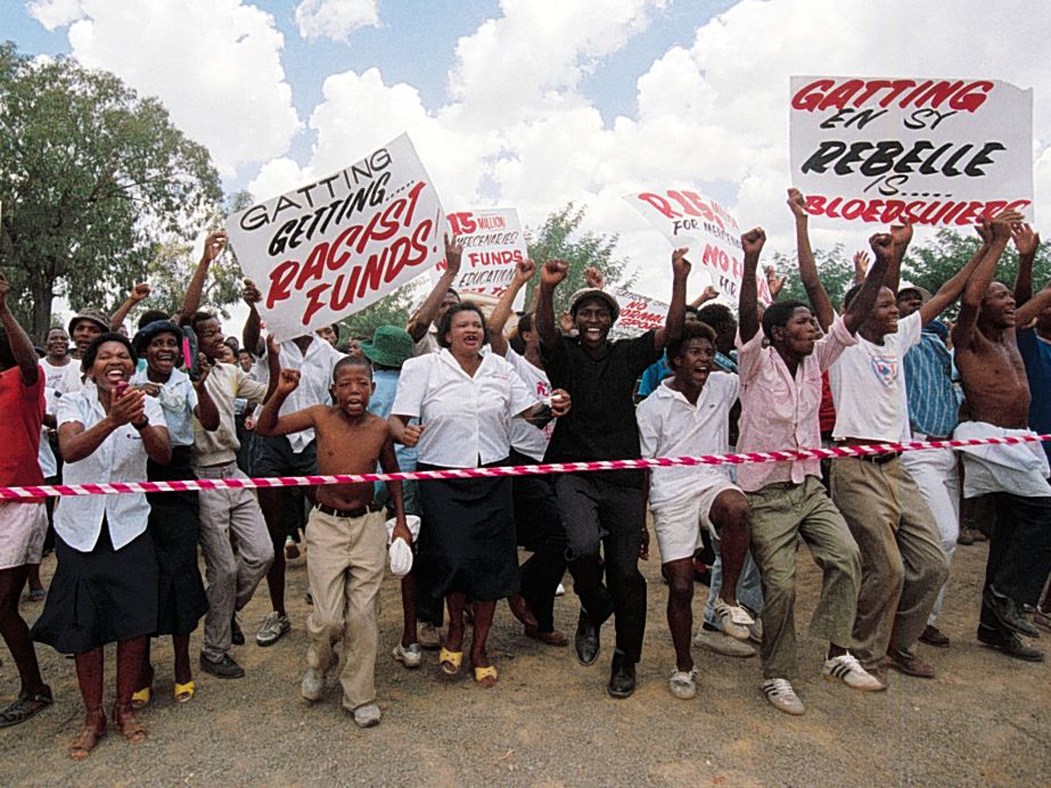 Signs of the times: Protesters against Mike Gatting’s rebel tour in 1990 were later met with teargas and rubber bullets