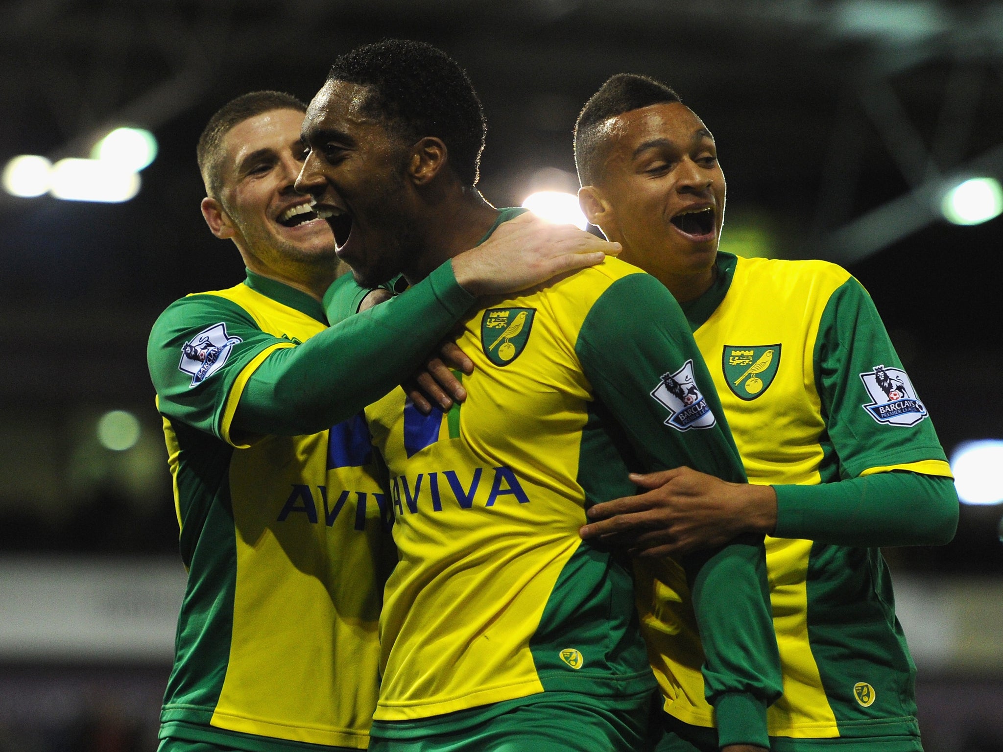 Leroy Fer (C) celebrates with Gary Hooper (L) and Josh Murphy (R) after scoring for Norwich