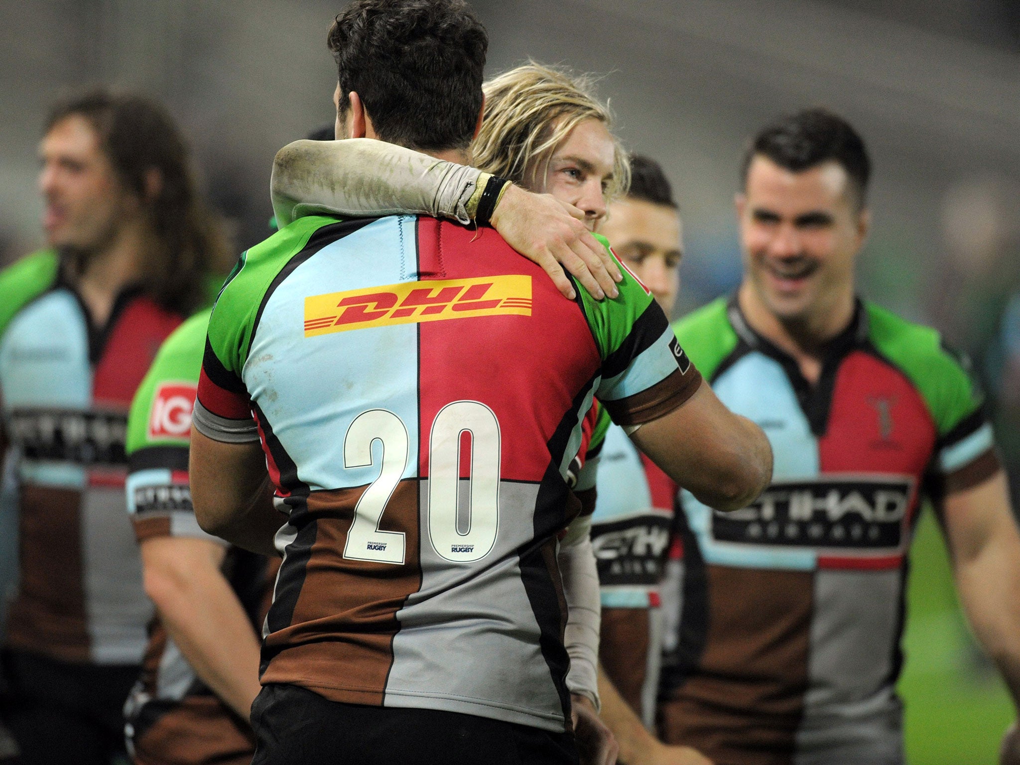 Harlequins' winger Tom Williams (C) celebrates with his teammate Harlequins' flanker Joe Trayfoot (C-back) at the end of the European Cup rugby union match between Racing Metro 92 and Harlequins