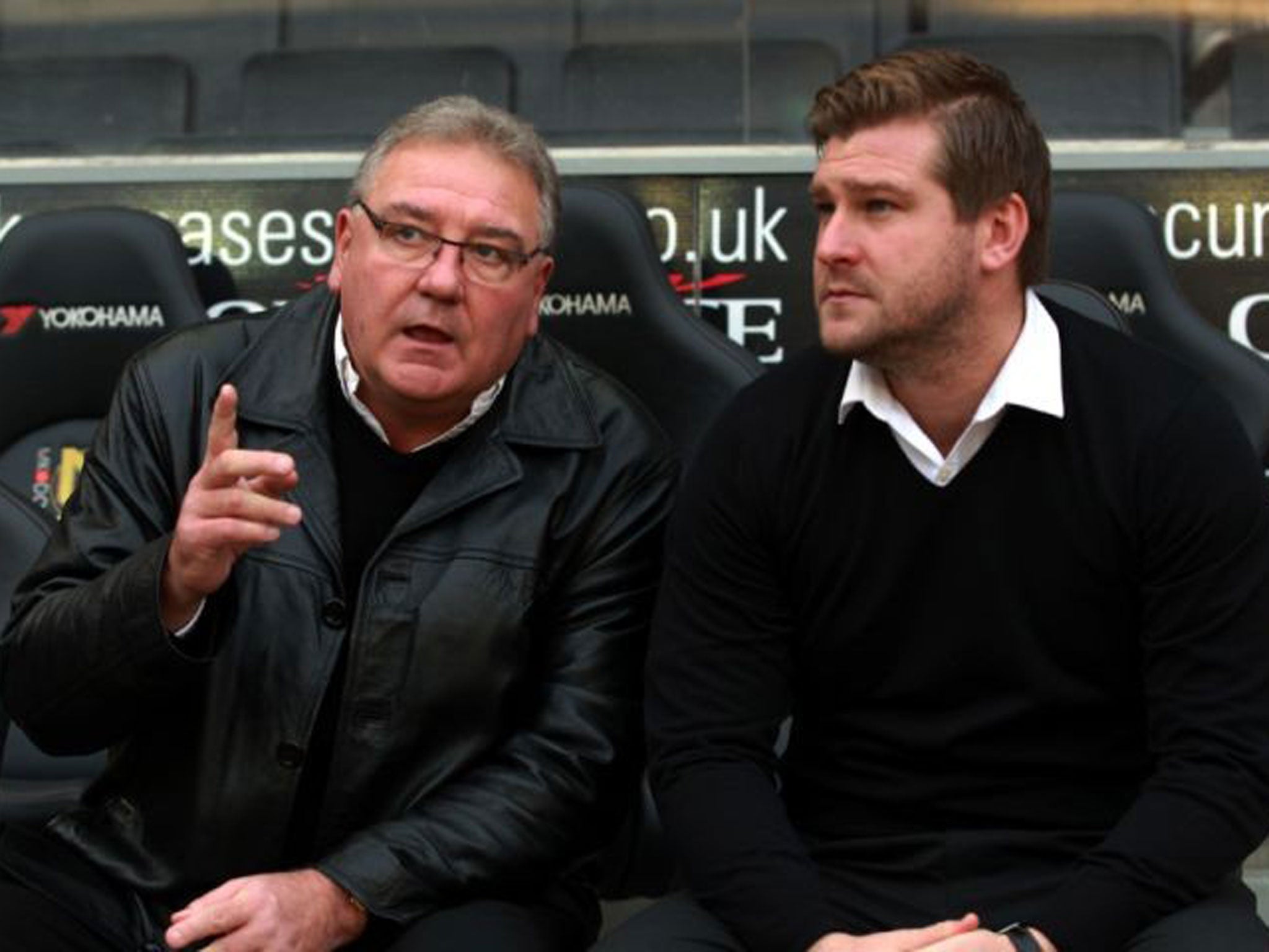 Karl Robinson chats on the bench with Michael Calvin