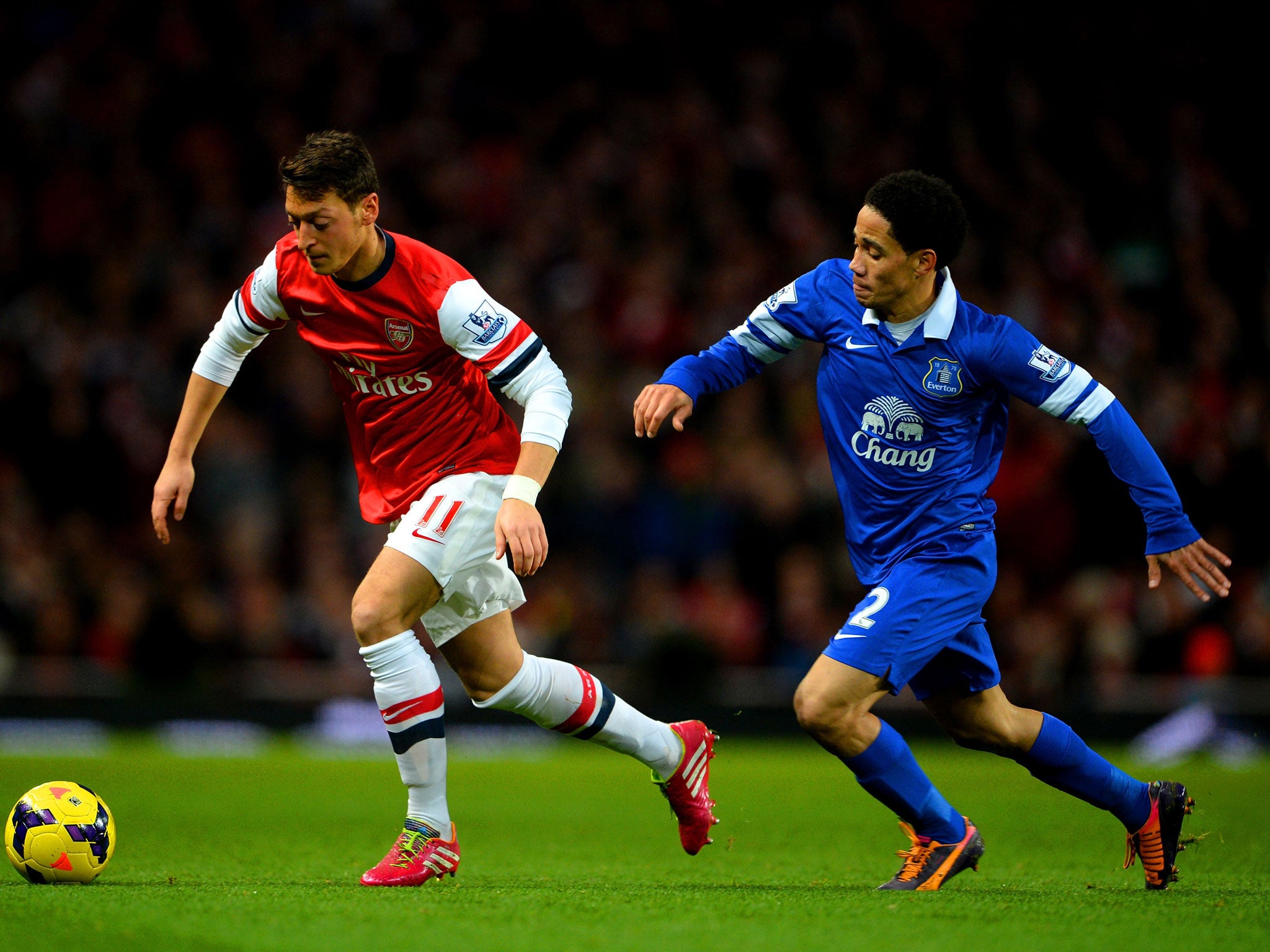 Mesut Ozil is tracked by Steven Pienaar