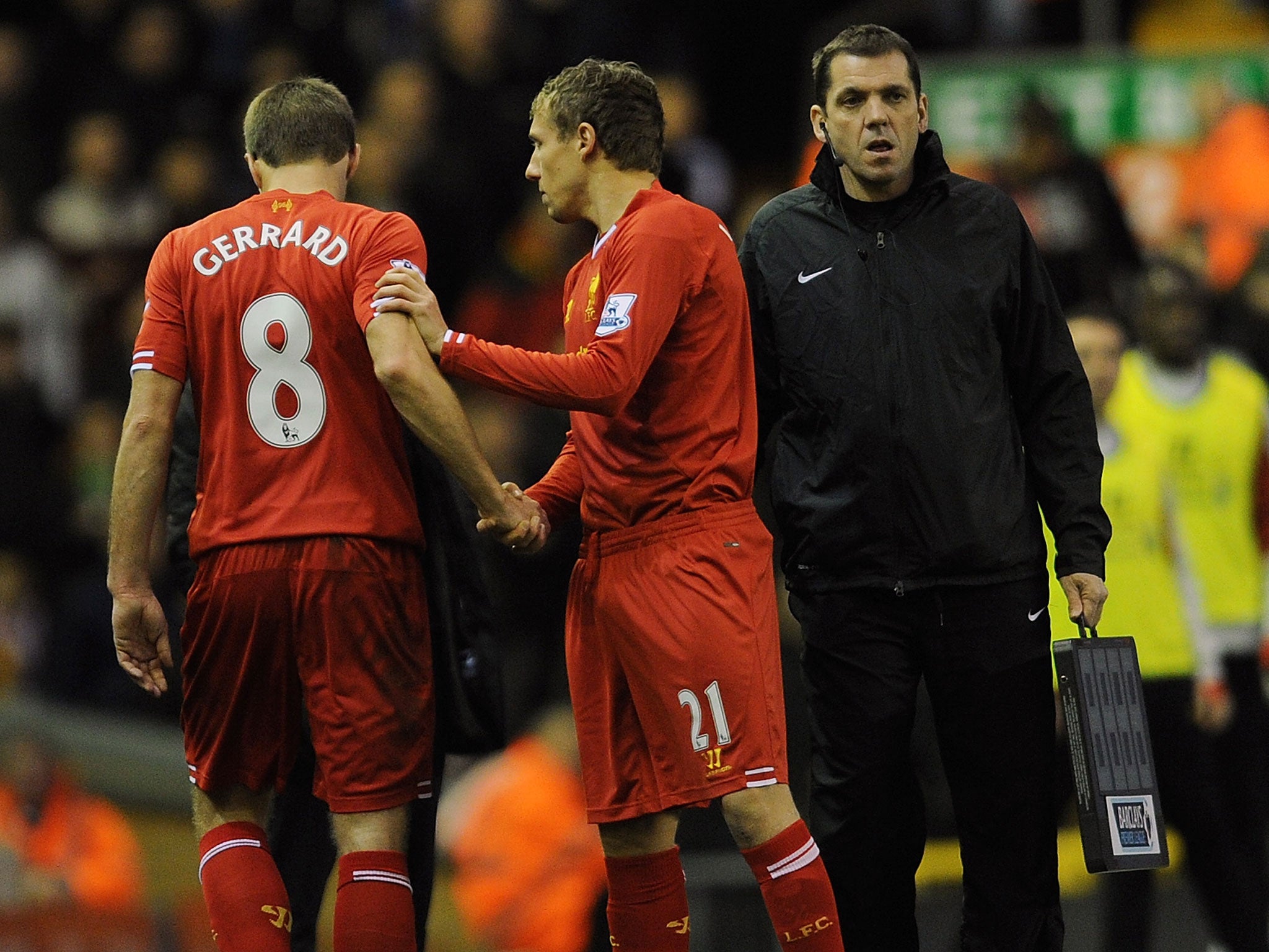 Lucas Leiva (right) comes on for Steven Gerrard on Saturday