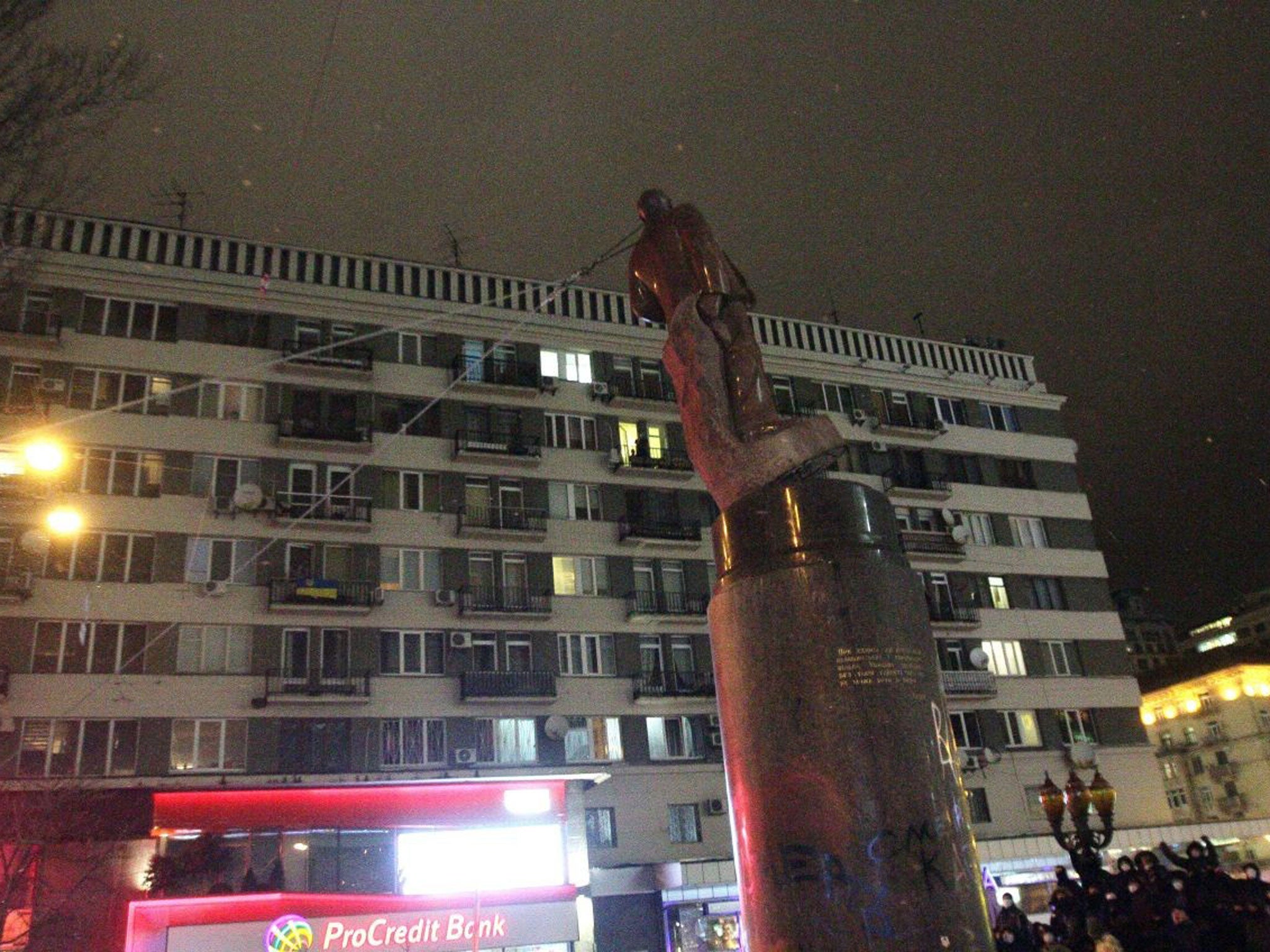 Protesters pull down a statue of Lenin at a monument in his honour during a mass rally in Kiev's Independence Square