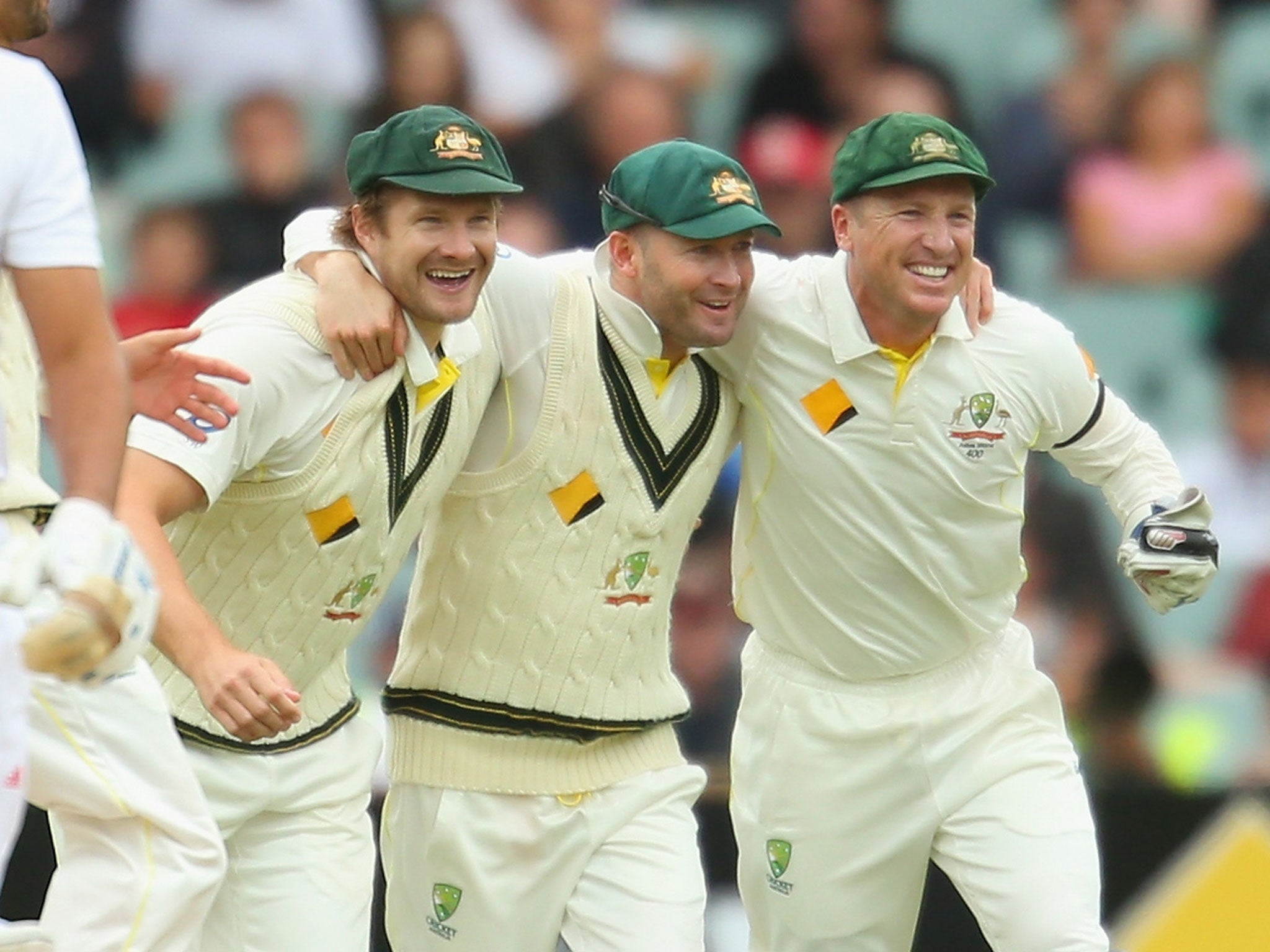 Australia captain Michael Clarke (C) celebrates with Shane Watson (L) and Brad Haddin (R) after victory over England in the Ashes Second Test