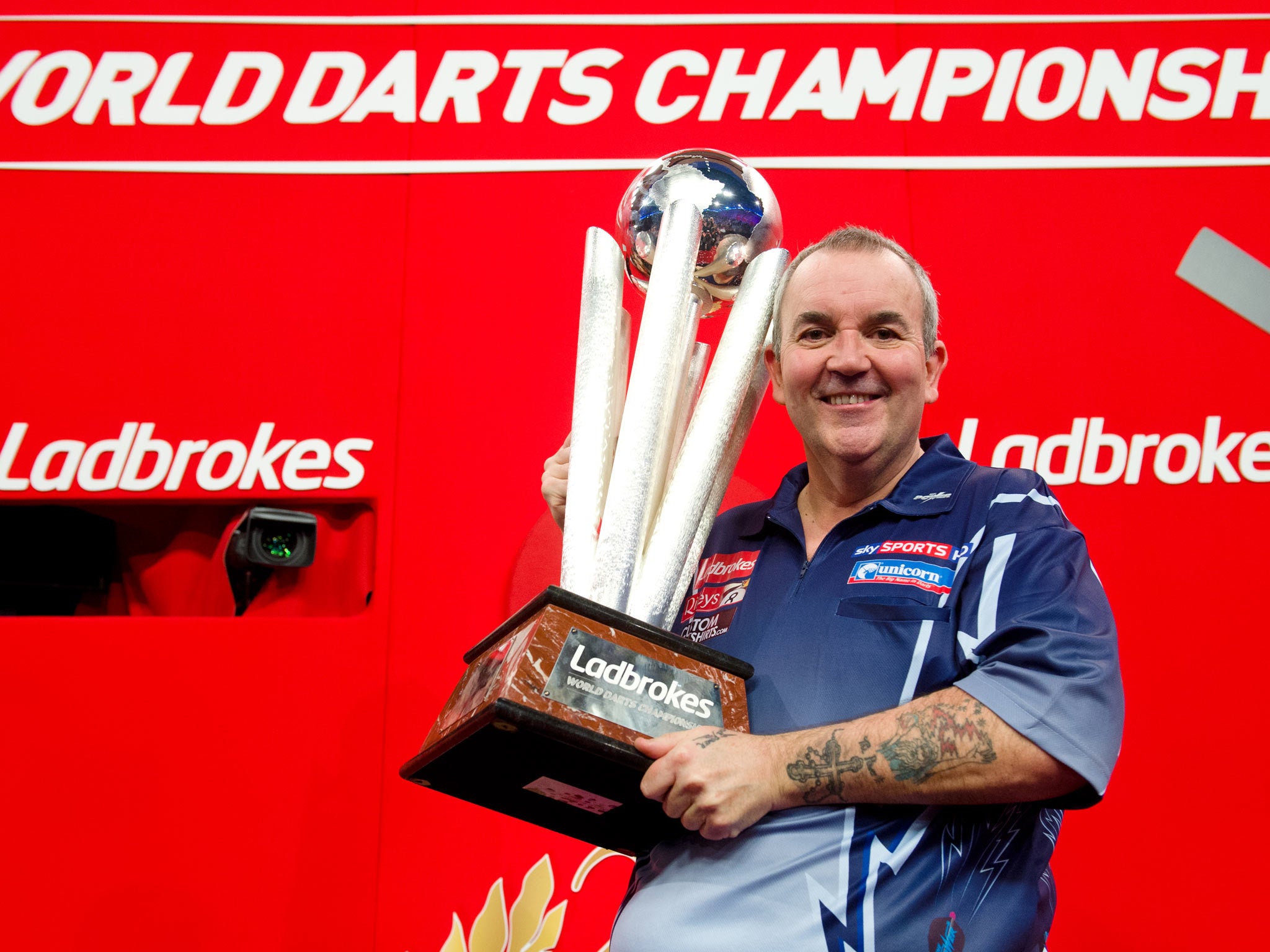 Phil Taylor celebrates winning the title last year