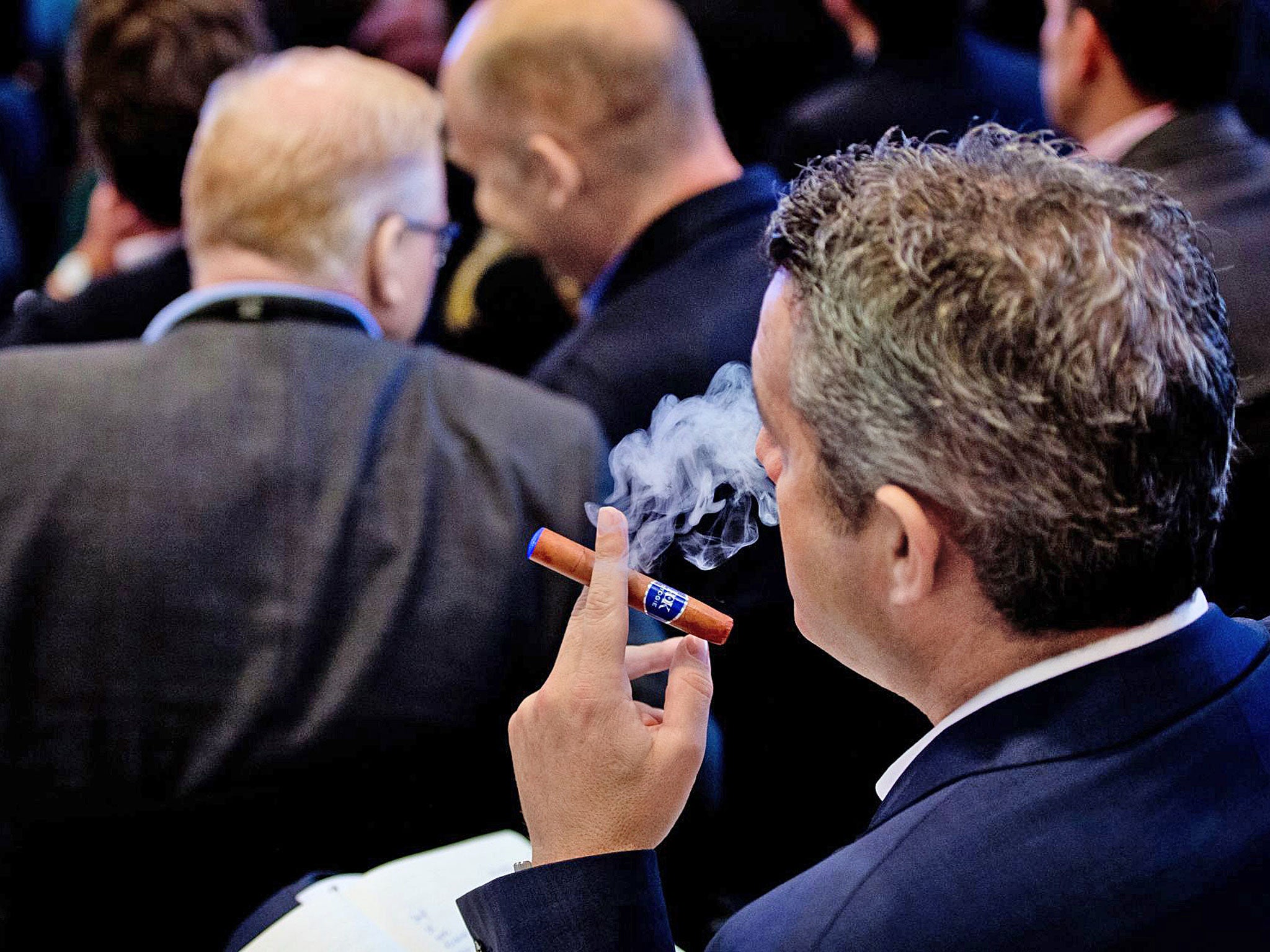 Puff piece: a delegate uses an e-cigar during London's 'E-Cigarette Summit' in November