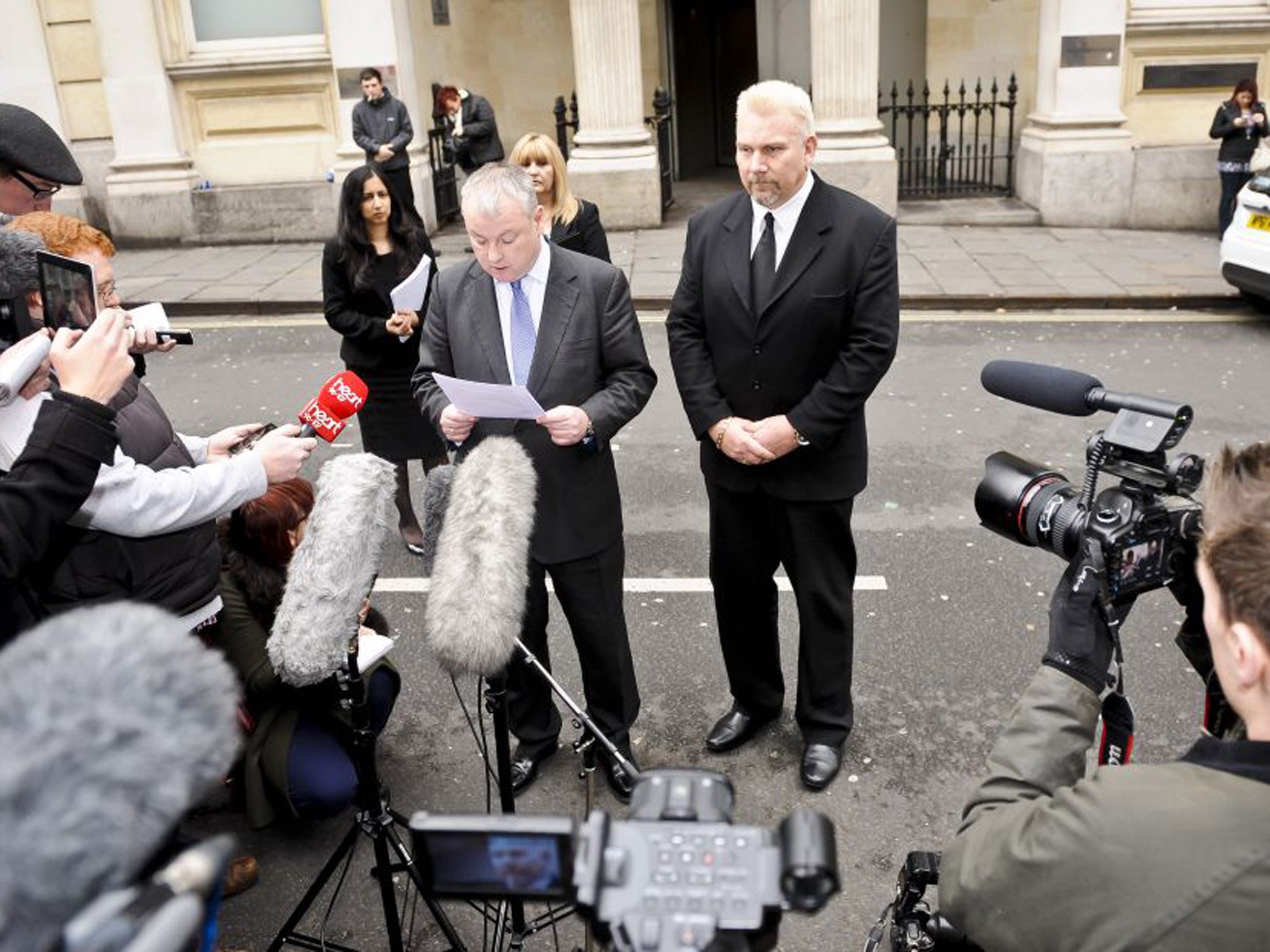 Fireworks contractor Geoffrey Counsell, 51, (right) with a member of his legal team, Gavin Reese (centre), outside Bristol Crown Court where he was cleared of breaching health and safety laws in relation to a firework display held on the night of a massi