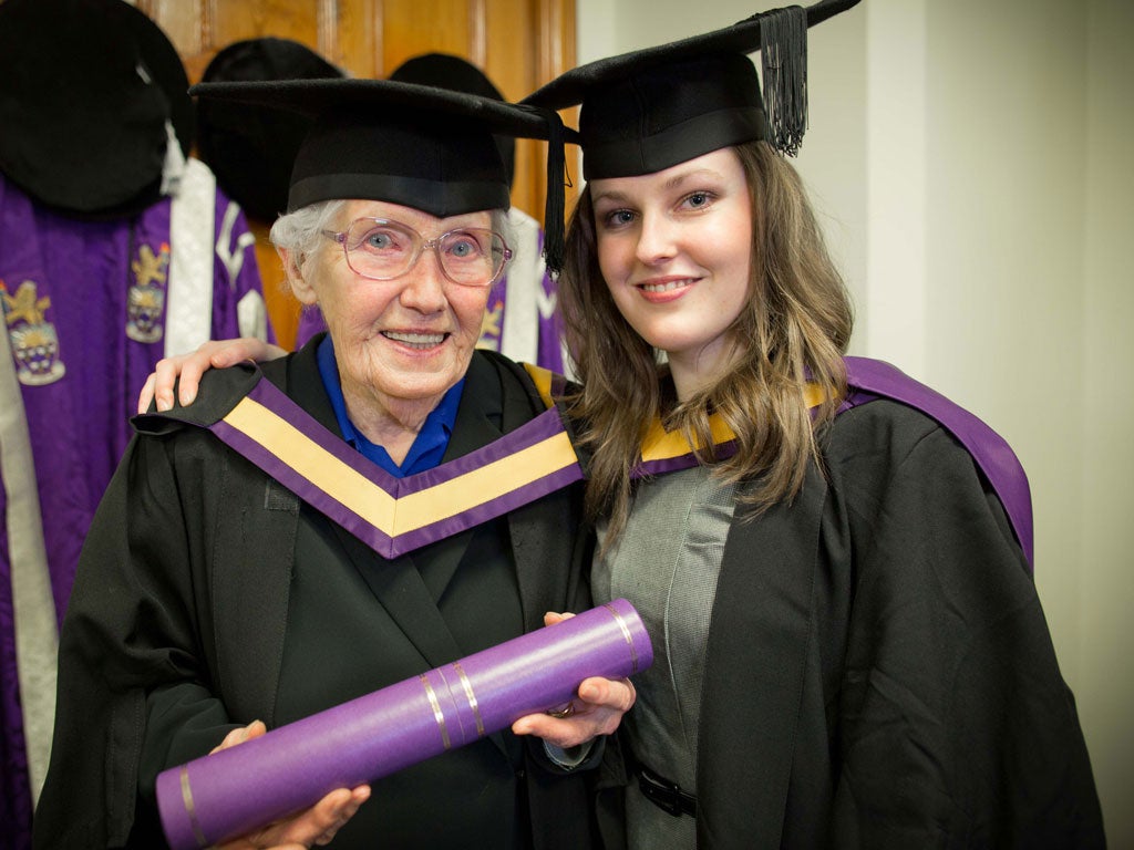 Gene Hetherington (left) and her granddaughter Rachel collect their degrees from the University at Manchester