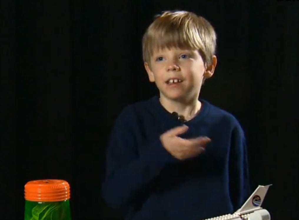 6-year-old Connor Johnson is pictured with his piggy bank (left) in a screengrab from USA Today.