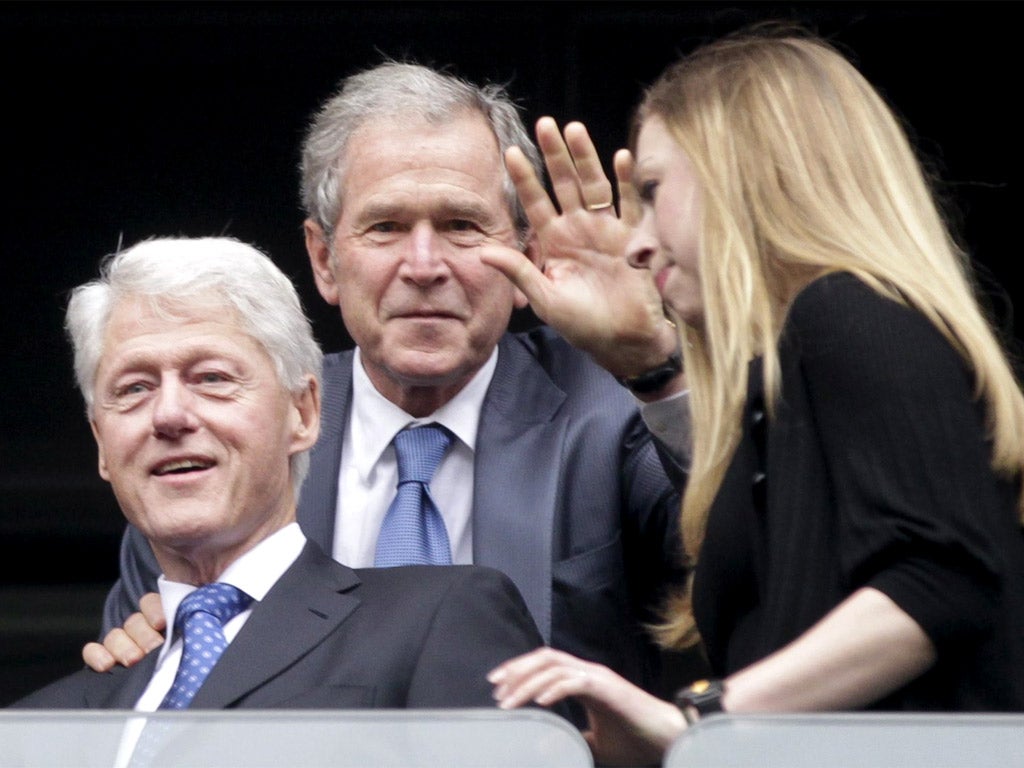 Former US presidents Bill Clinton, George W. Bush and Clinton's daughter Chelsea