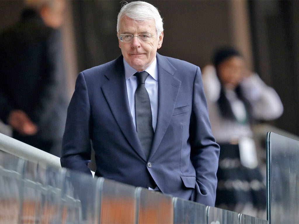 Former British Prime Minister John Major arrives at the memorial service