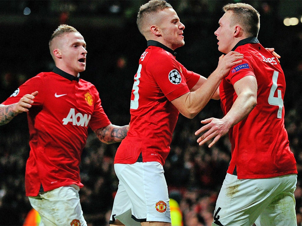 Teammates celebrate with goalscorer Phil Jones