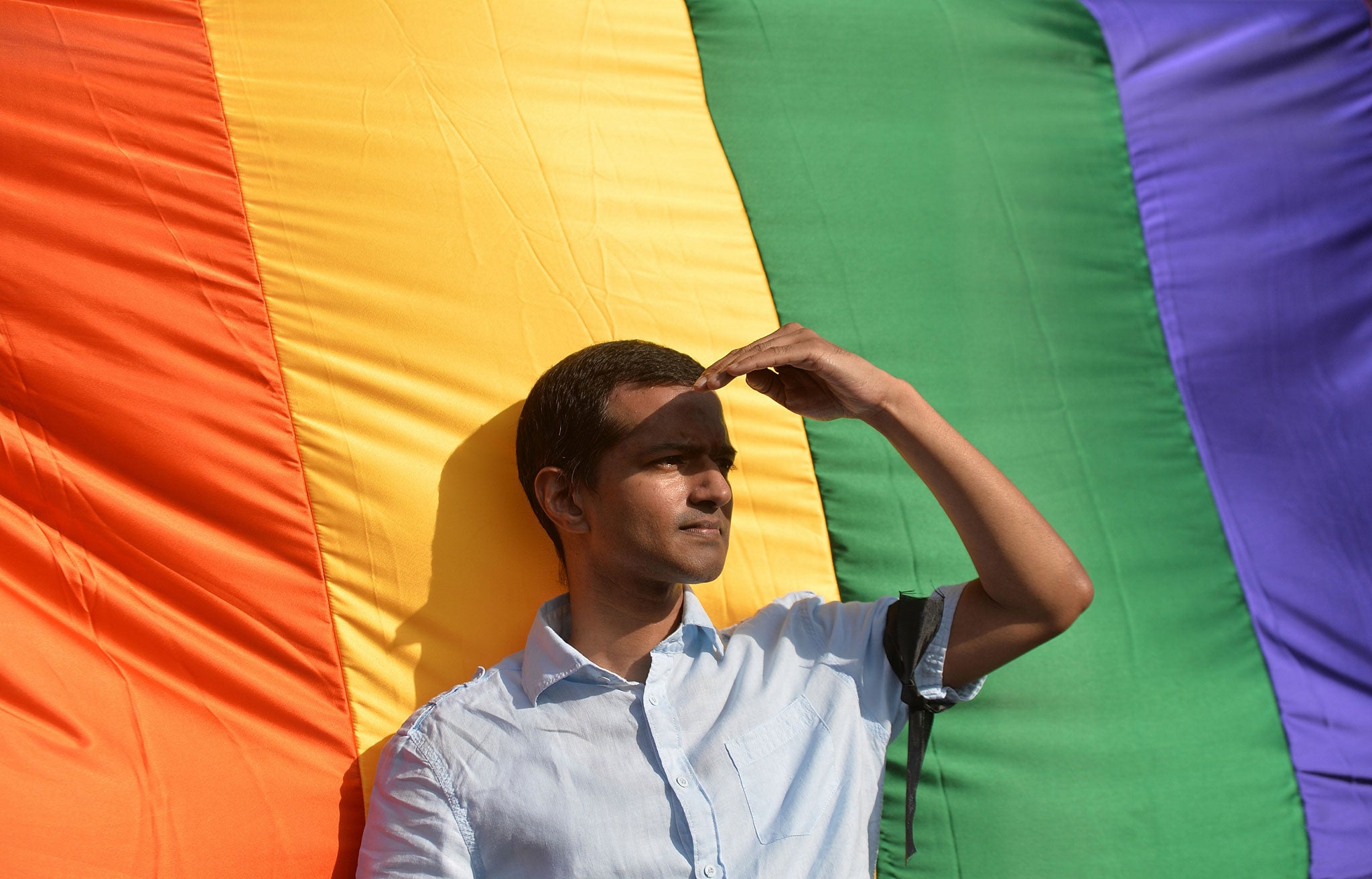 An Indian gay-rights activist looks on during a protest against the Supreme Court ruling reinstating a ban on gay sex