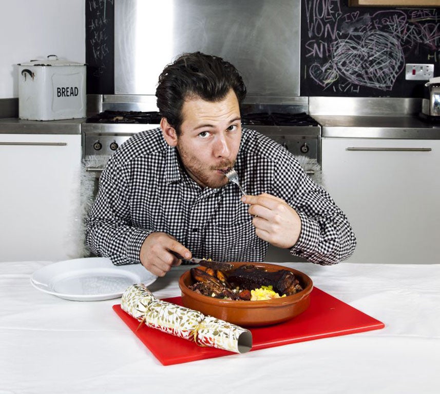 Josh de Lisser tucks into his Jamaican Christmas meal of pork pot roast with ackee and saltfish