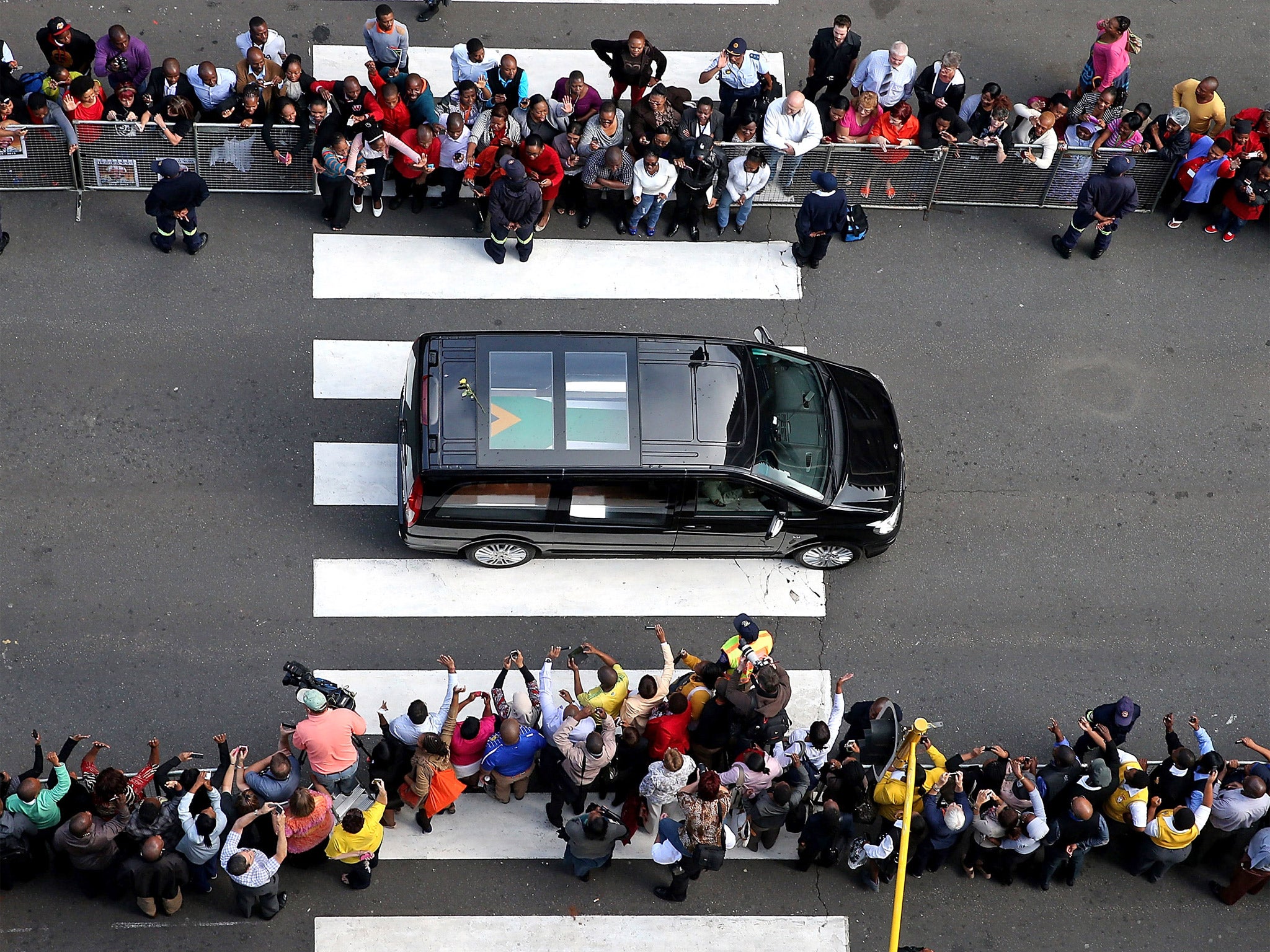 The body of Nelson Mandela is transported to the Union Buildings where it is lying in state for three days