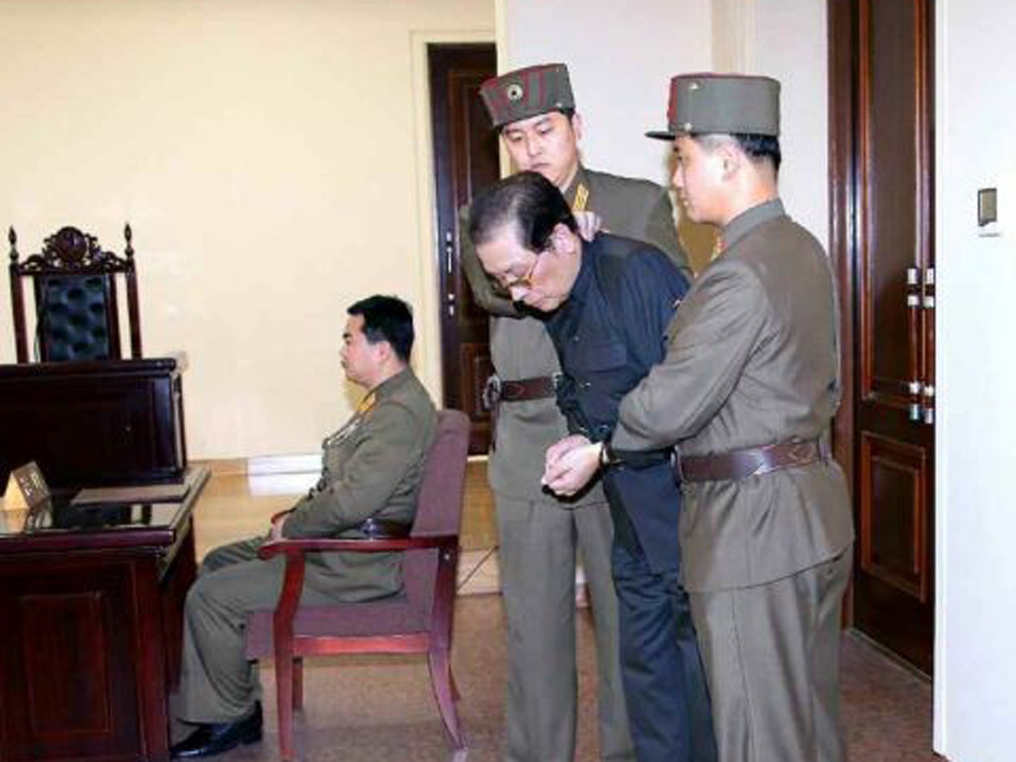 Jang Song Thaek being escorted to court