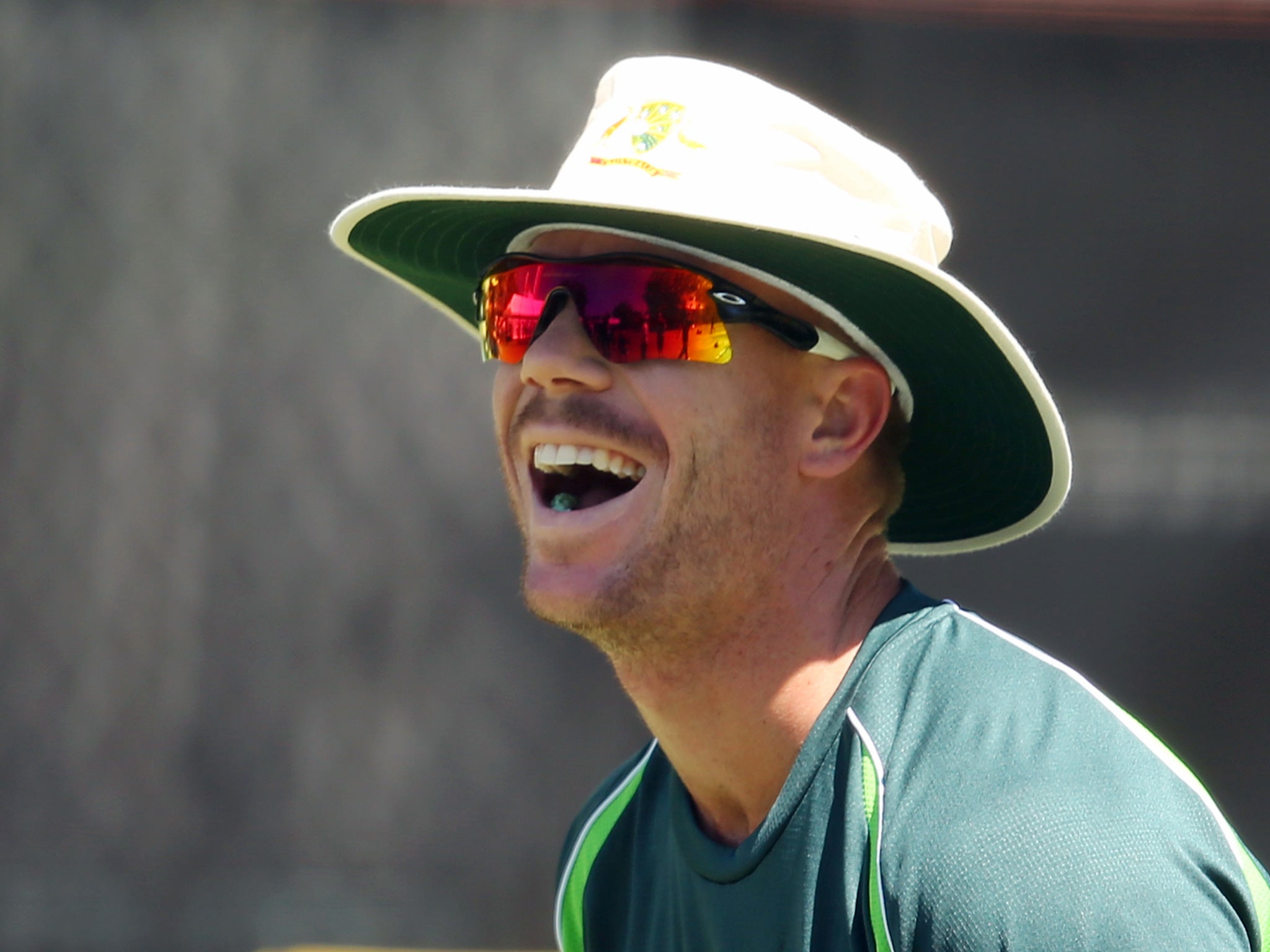 Plenty to laugh about: David Warner of Australia shares a laugh with his team during a nets session in Perth