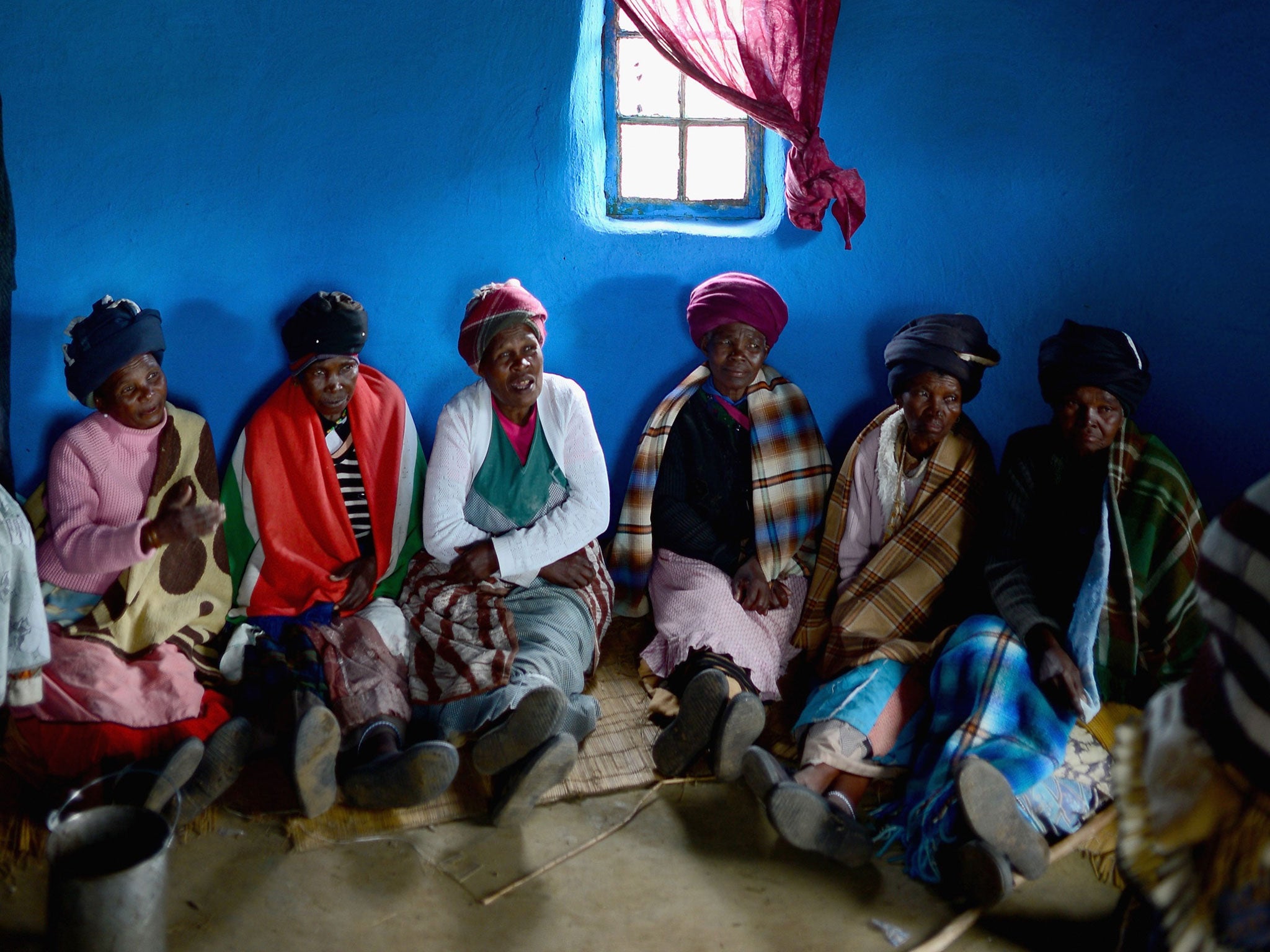 Xhosa women inside a house in the nearby village of Mvezo, where Mandela was born