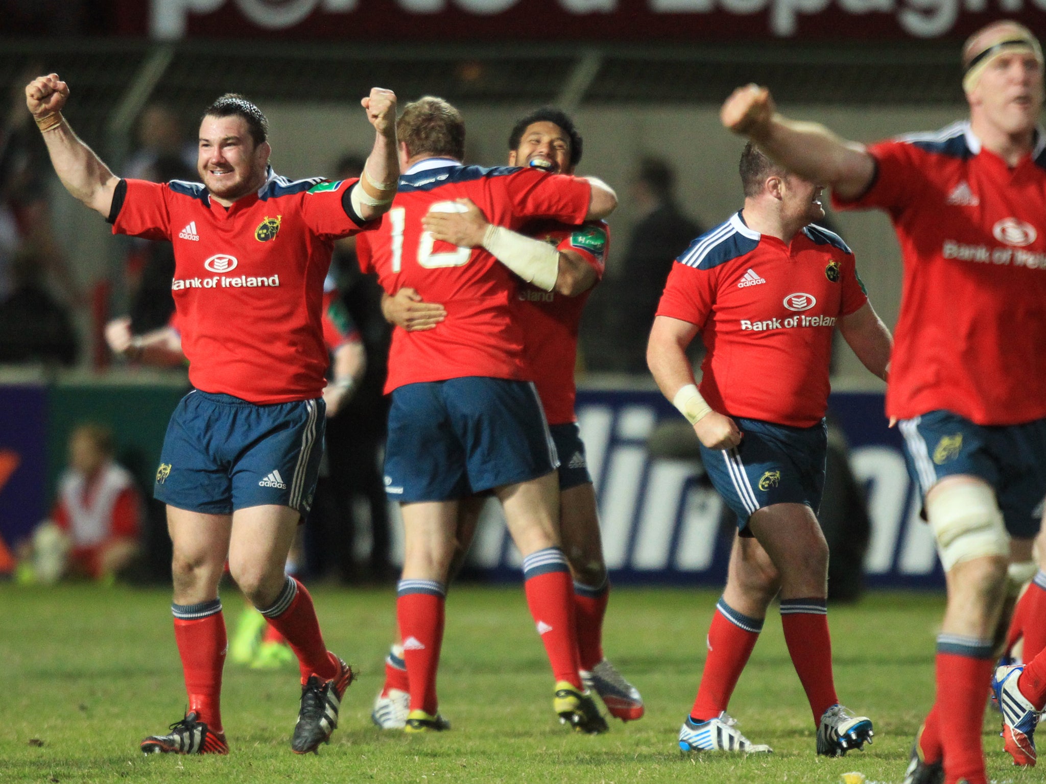 Munster celebrate after their late victory over Perpignan