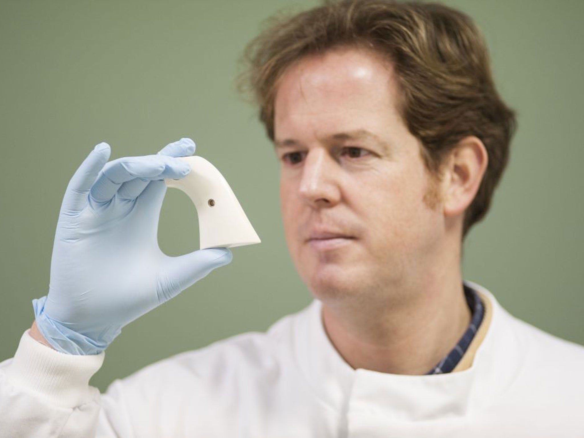 Rob Ogden, of Edinburgh Zoo, examines ivory artefacts