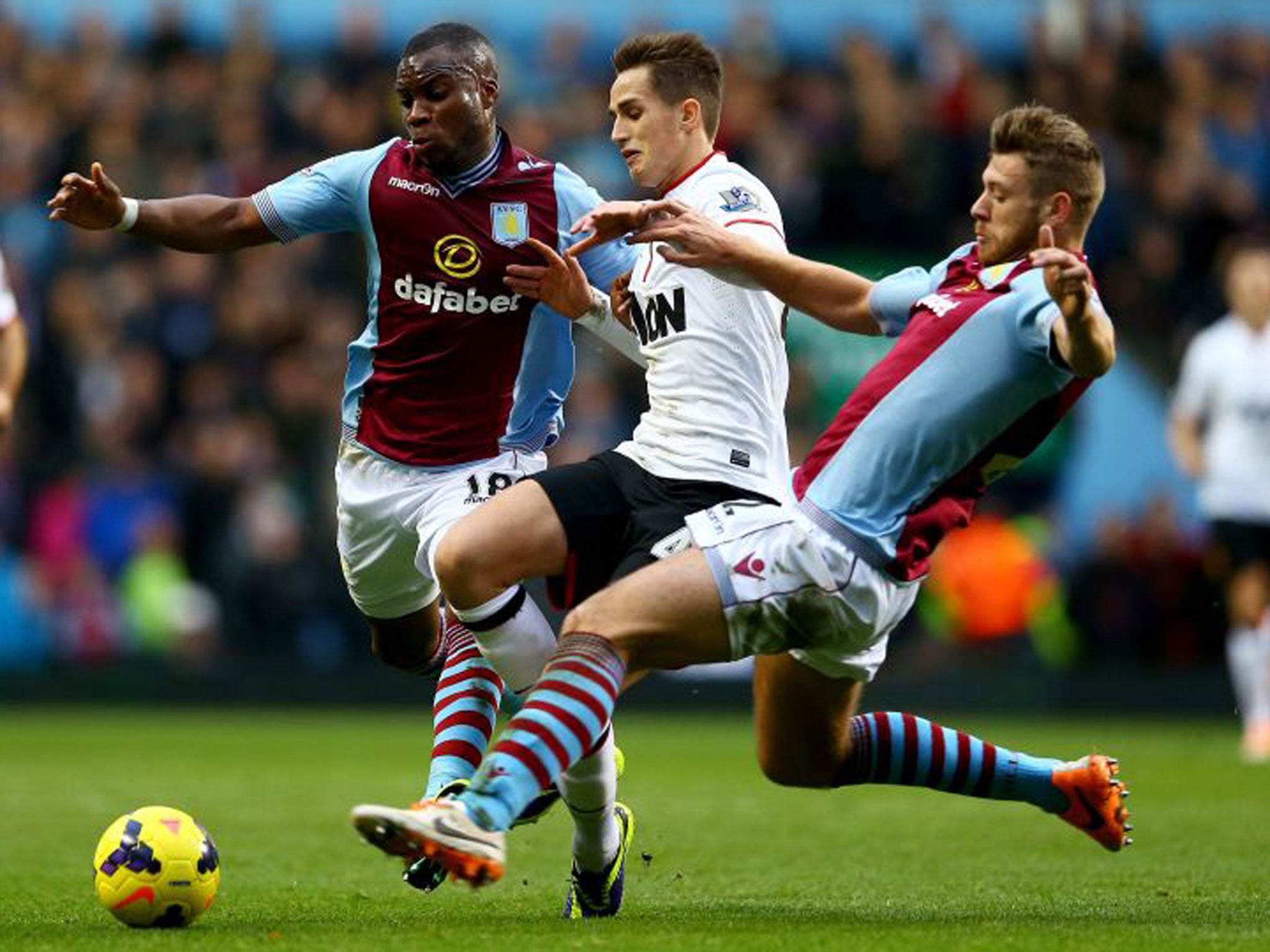 Manchester United's Adnan Januzaj goes between Yacouba Sylla (left) and Nathan Baker of Aston Villa