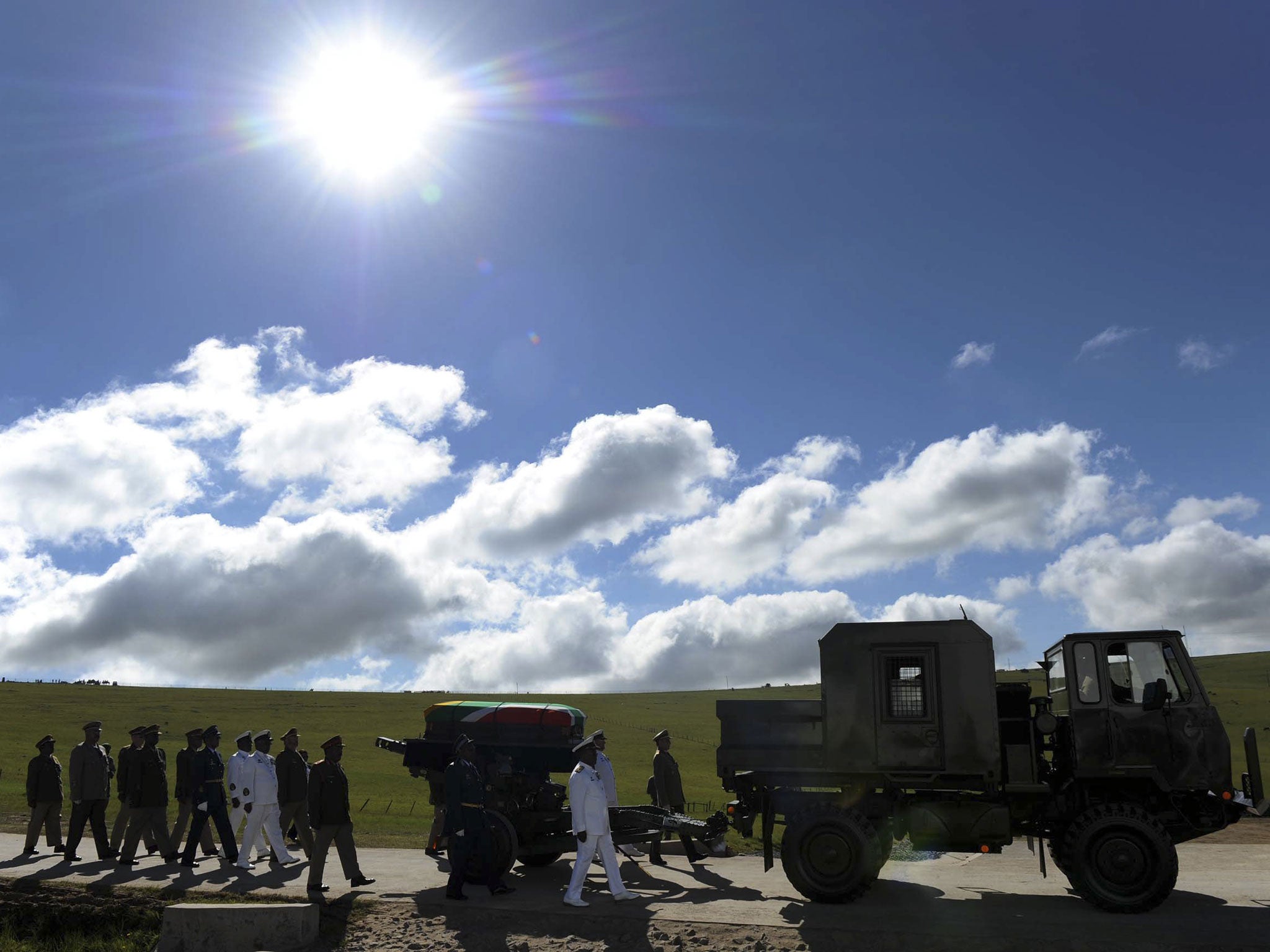 The coffin of former South African President Nelson Mandela arrives on a gun carriage for his funeral ceremony in Qunu, Eastern Cape