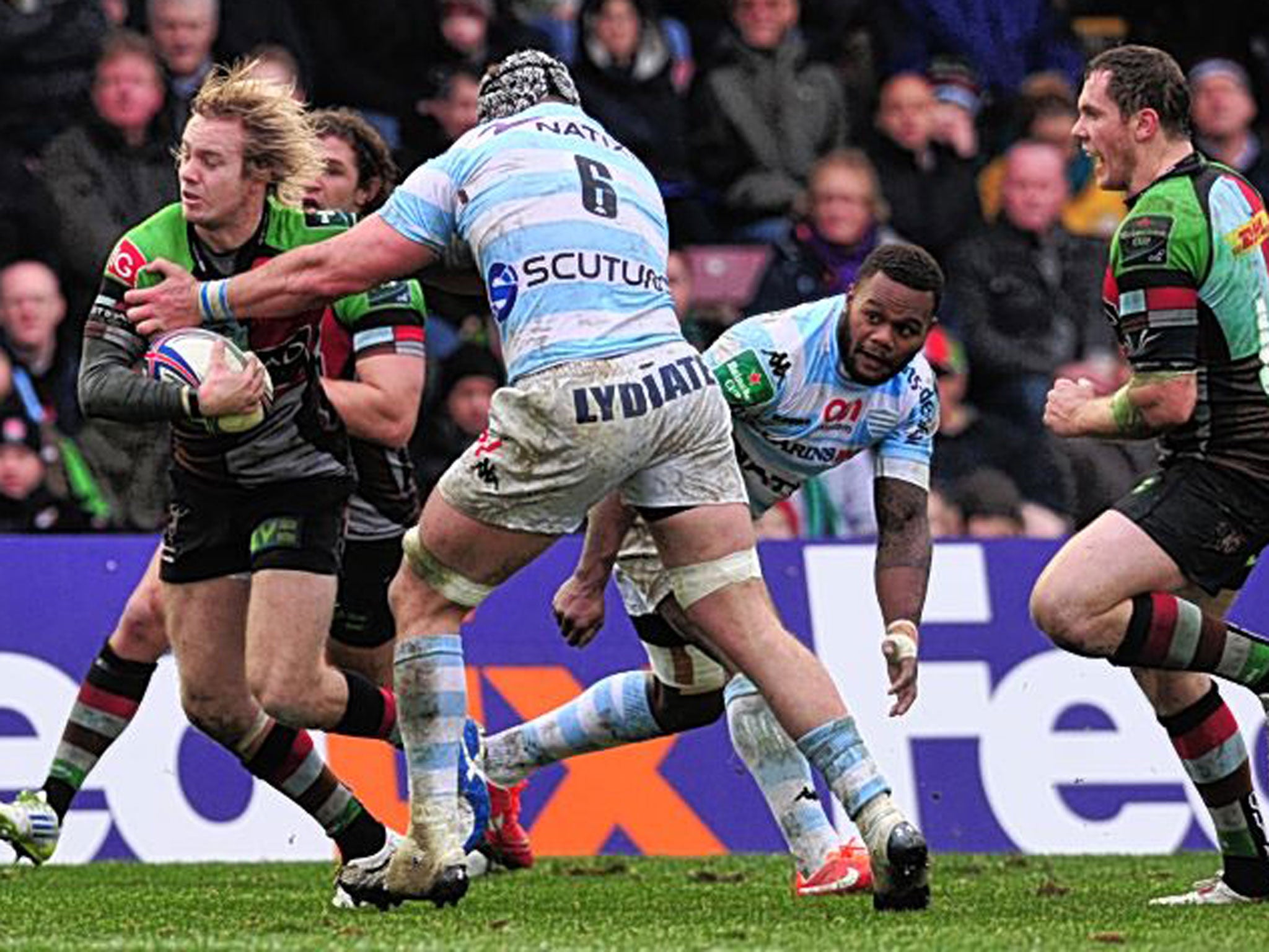 Harlequins’ Charlie Walker breaks a tackle to score a try against Racing Metro