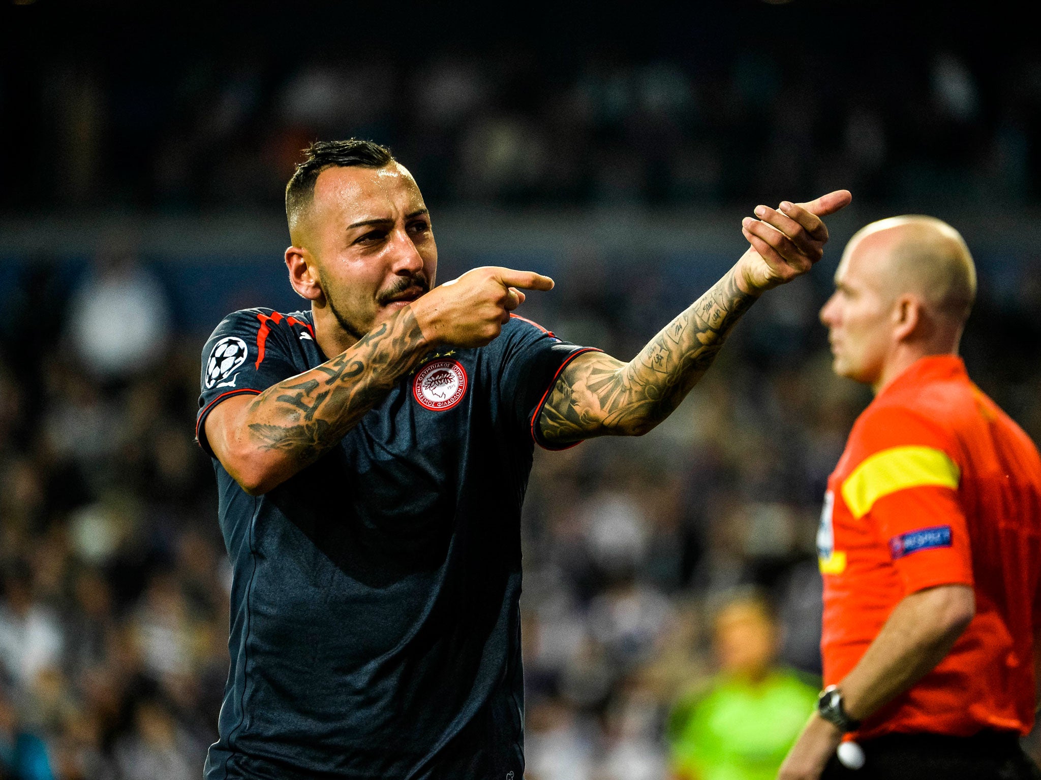 Olympiakos' Konstantinos Mitroglou celebrates after scoring