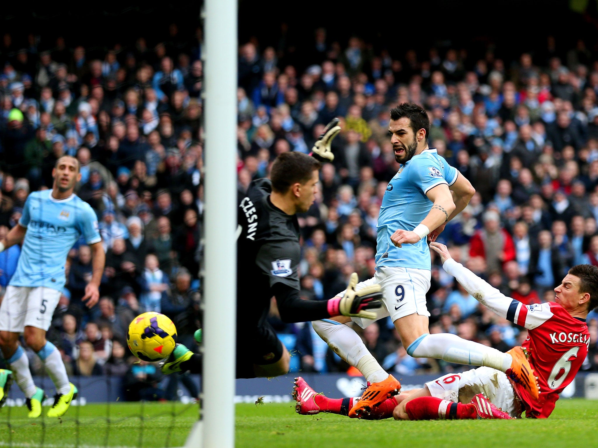 Alvaro Negredo scores for Manchester City against Arsenal