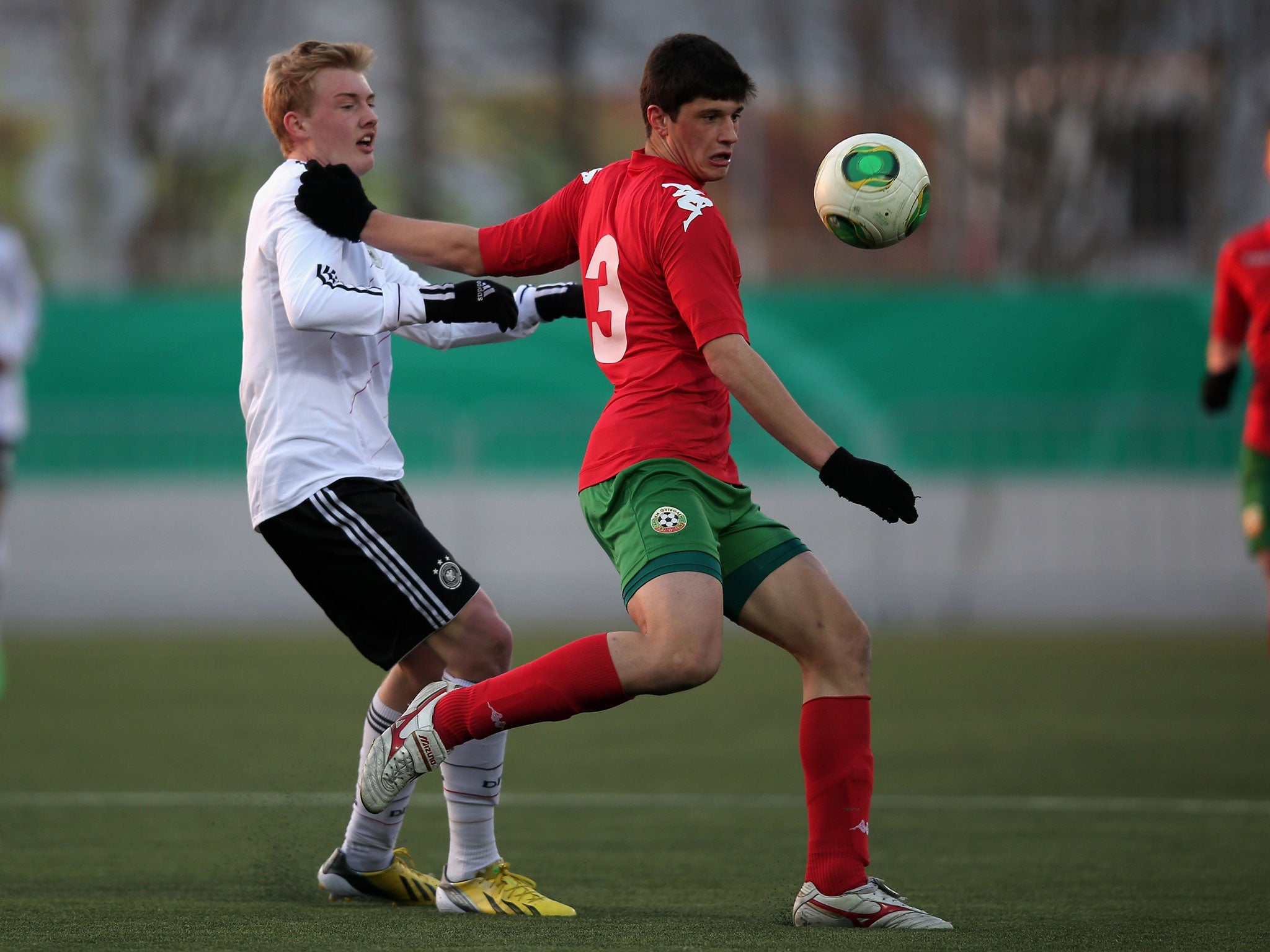 Julian Brandt of Germany and Stefan Ivov Velkov of Bulgaria battle for the ball