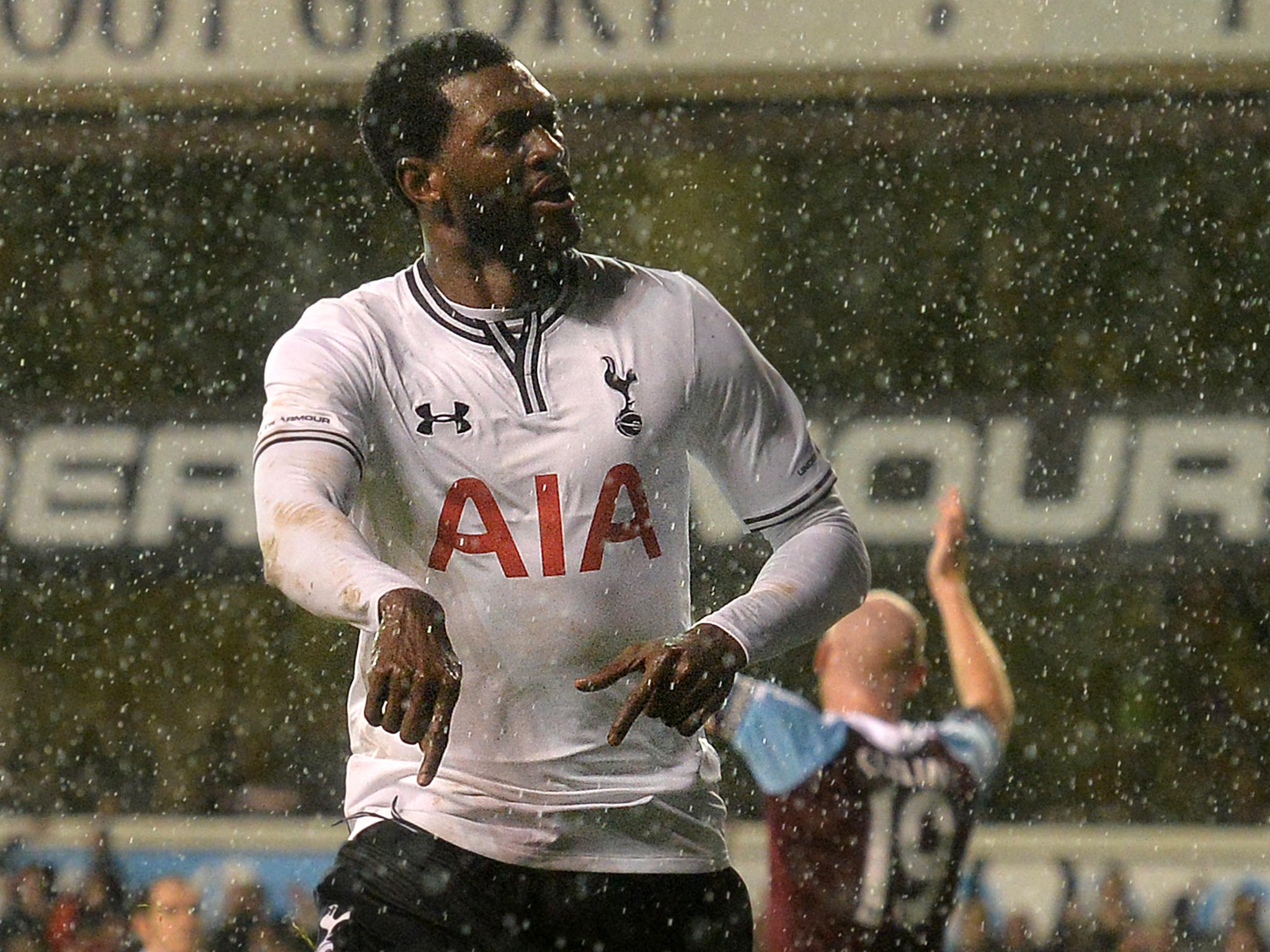 Emmanuel Adebayor celebrates a goal against West Ham