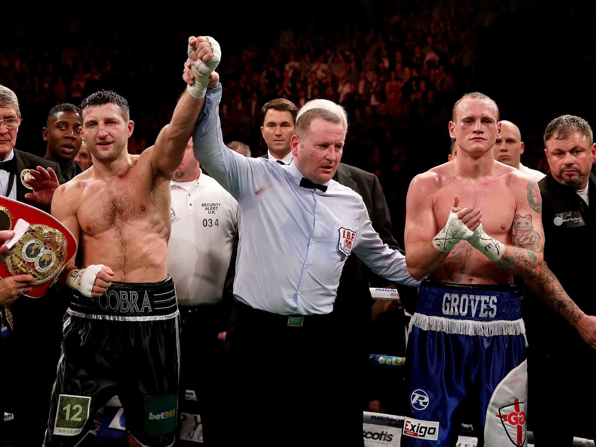 Carl Froch's arm is raised after his controversial win over George Groves in November