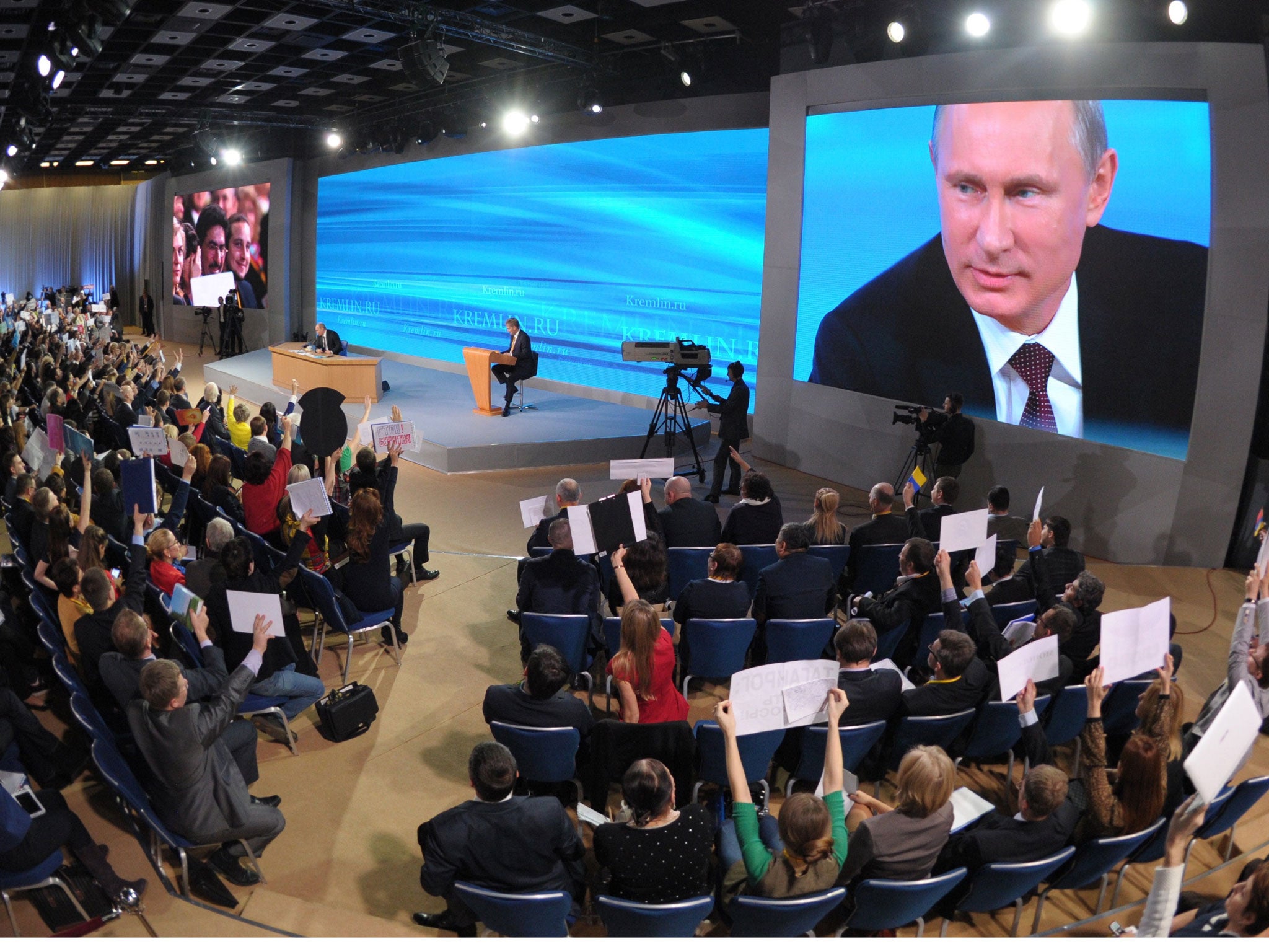 Russian President Vladimir Putin speaks during his annual press conference in Moscow; he later announced the surprise early release of the former Yukos oil tycoon