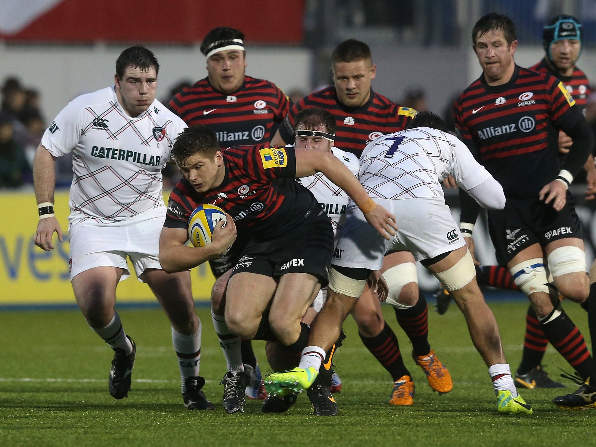 Owen Farrell tries to break through the Leicester defence