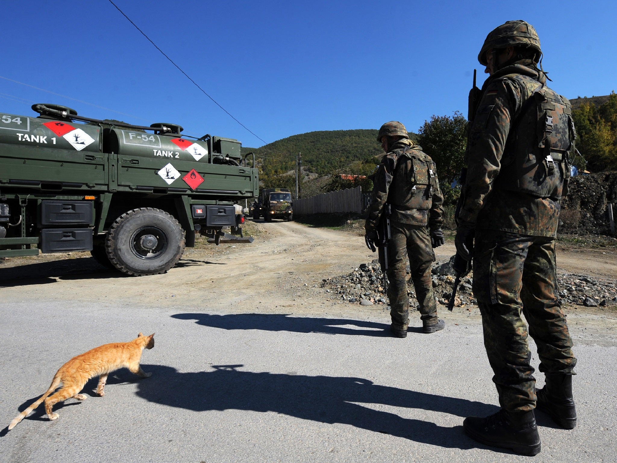 KFOR soldiers patrol near the village of Cabra, Kosovo on 18 October 2011