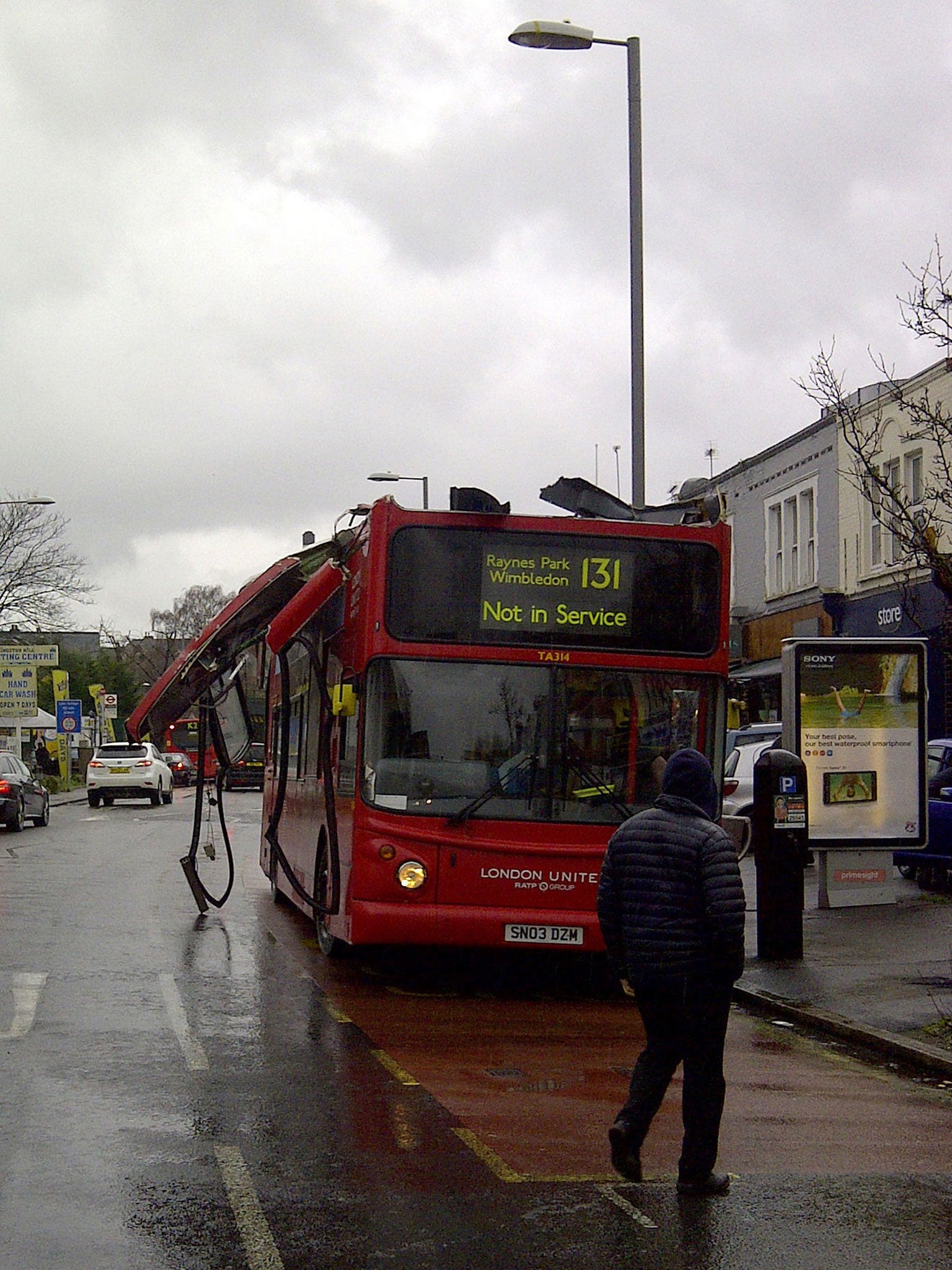 The double-decker almost sliced off its roof (PA)