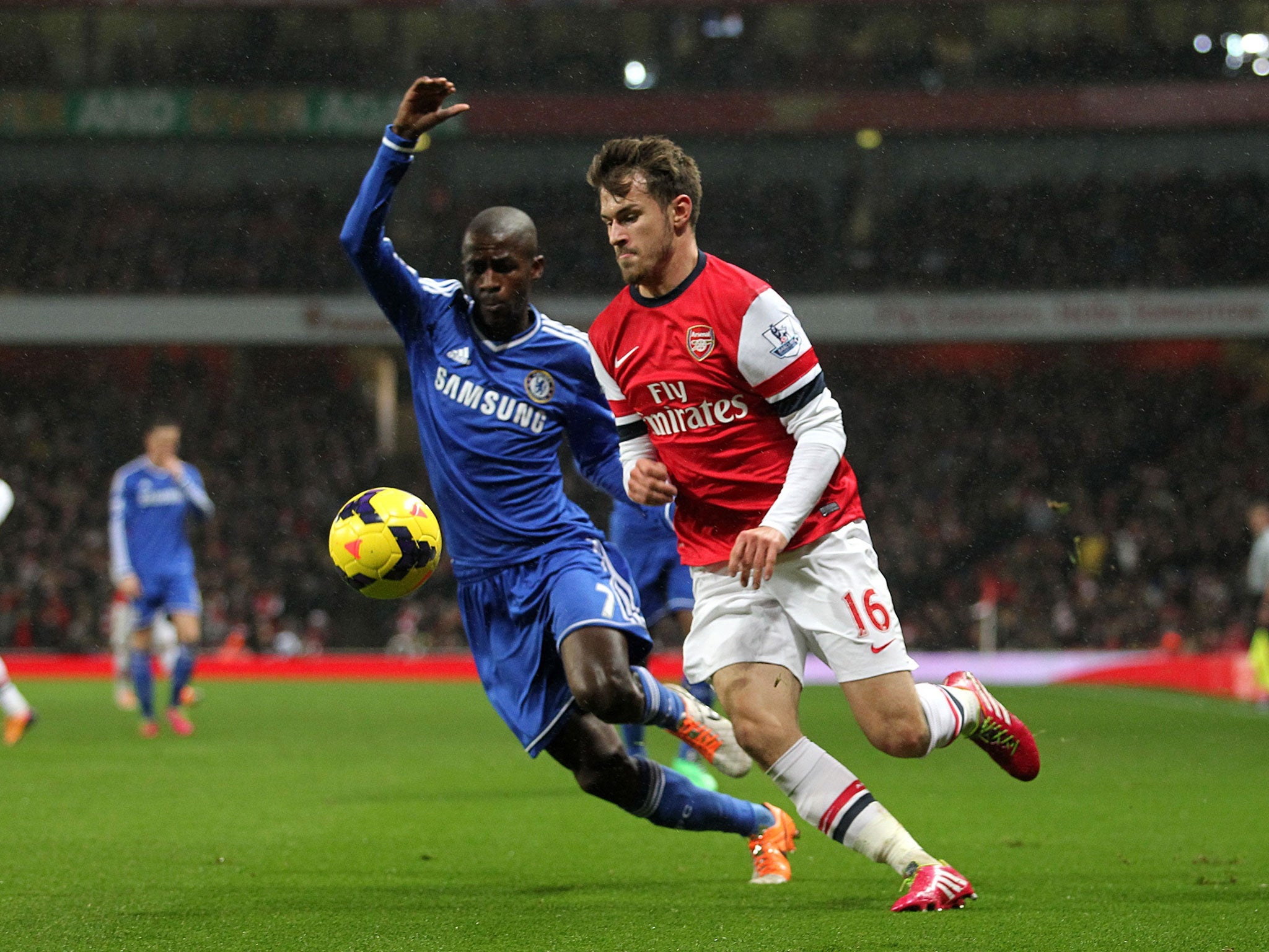 Arsenal's Aaron Ramsey tangles with Chelsea's Ramires during the draw at the Emirates