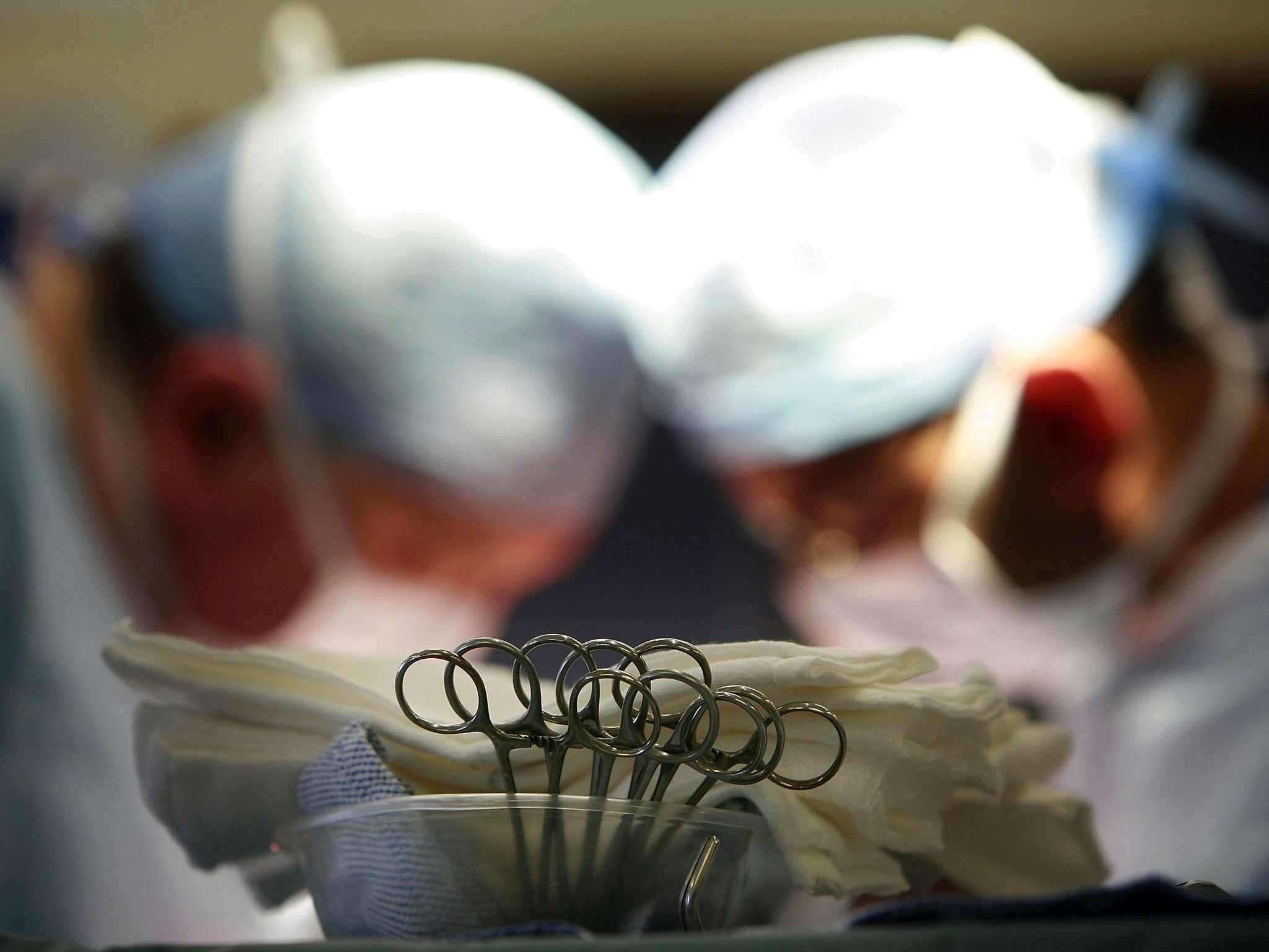 An operation at The Queen Elizabeth Hospital, Birmingham, the institution where a surgeon has been suspended.